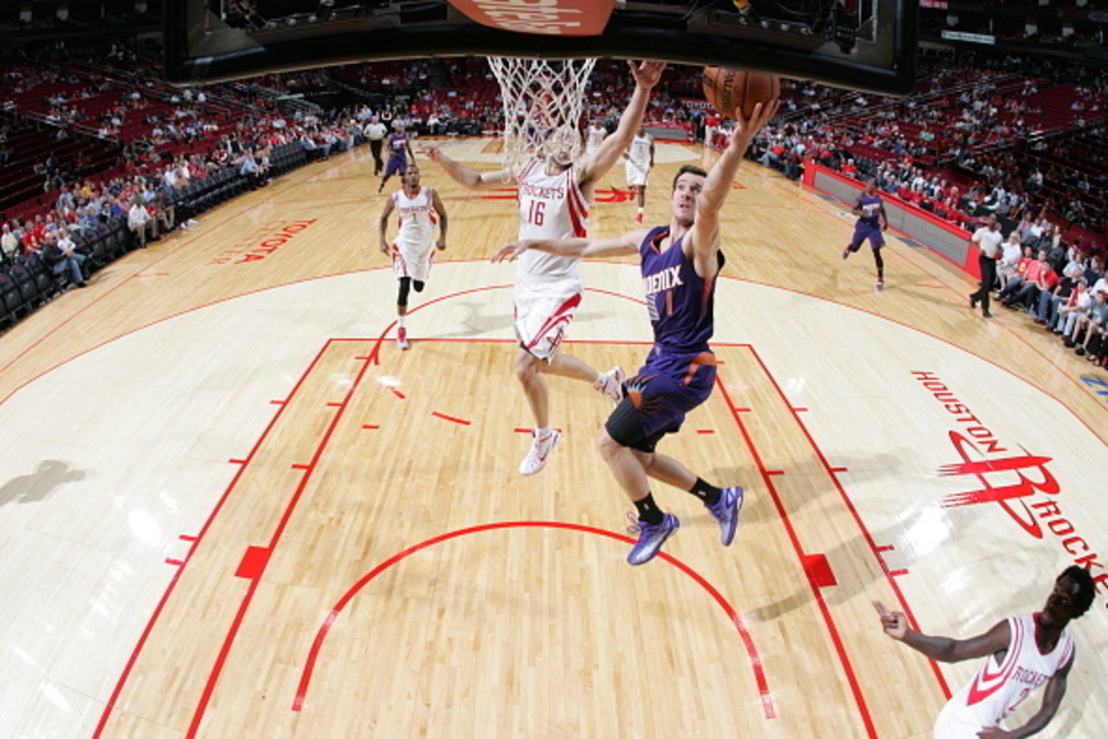 HOUSTON, TX - OCTOBER 13: Goran Dragic #1 of the Phoenix Suns goes up for a shot against the Houston Rockets on October 13, 2014 at the Toyota Center in Houston, Texas. NOTE TO USER: User expressly acknowledges and agrees that, by downloading and or using