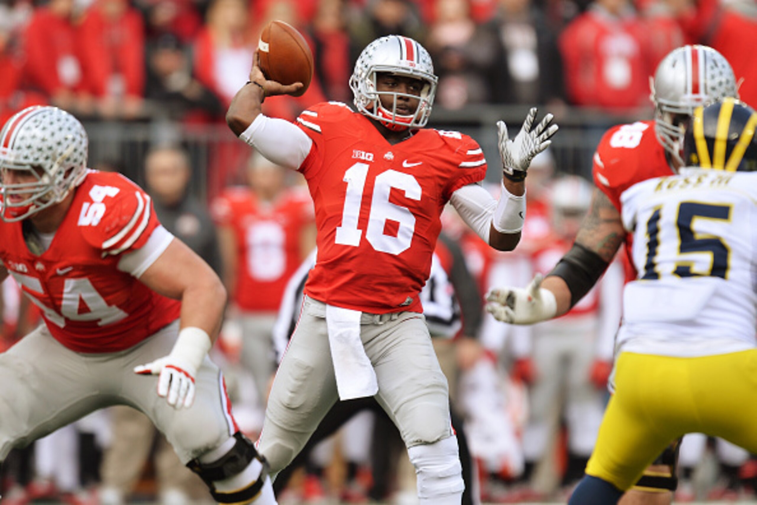 COLUMBUS, OH - NOVEMBER 29:  Quarterback J.T. Barrett #16 of the Ohio State Buckeyes passes against the Michigan Wolverines in the first quarter at Ohio Stadium on November 29, 2014 in Columbus, Ohio.  (Photo by Jamie Sabau/Getty Images)