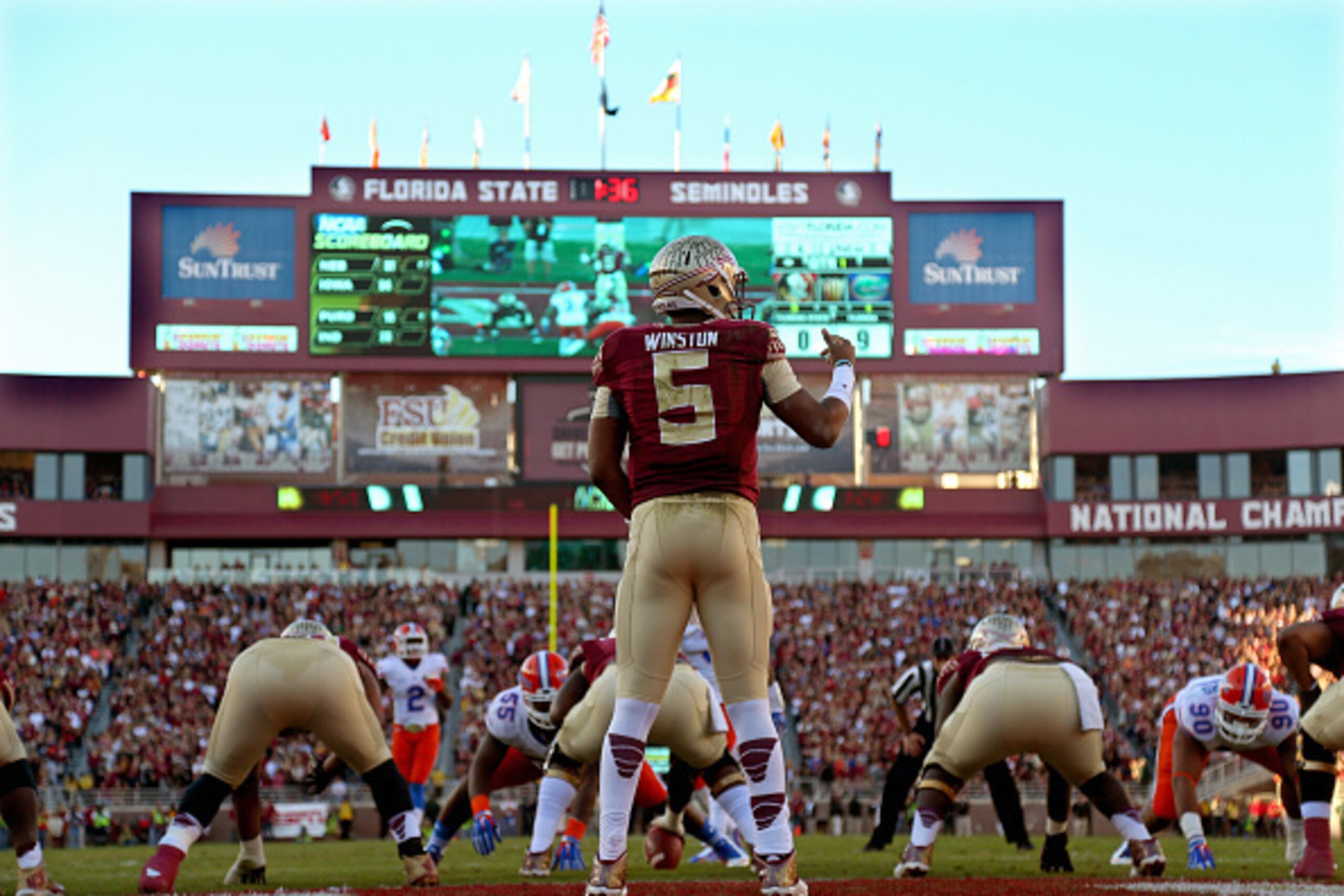 TALLAHASSEE, FL - NOVEMBER 29:  Jameis Winston #5 of the Florida State Seminoles looks turnover pass during  a game against the Florida Gators  at Doak Campbell Stadium on November 29, 2014 in Tallahassee, Florida.  (Photo by Mike Ehrmann/Getty Images)