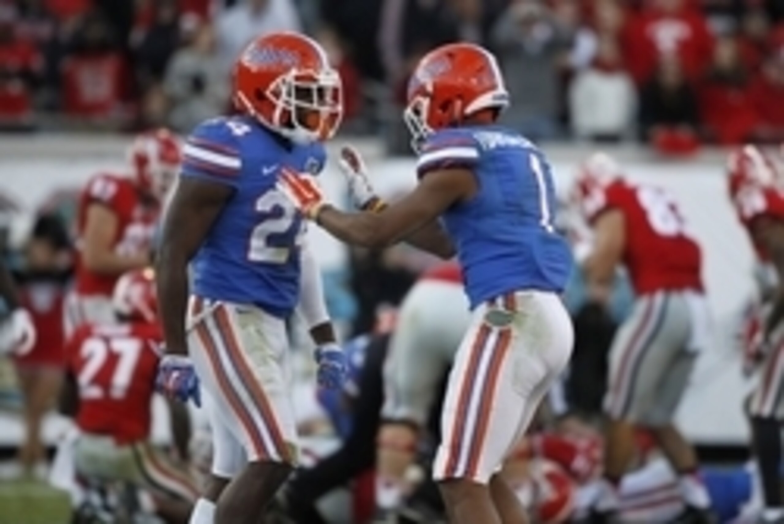 Nov 1, 2014; Jacksonville, FL, USA; Florida Gators defensive back Brian Poole (24) is congratulated by defensive back Vernon Hargreaves III (1) after he forces a fumble against the Georgia Bulldogs during the second half at EverBank Field. Florida Gators 