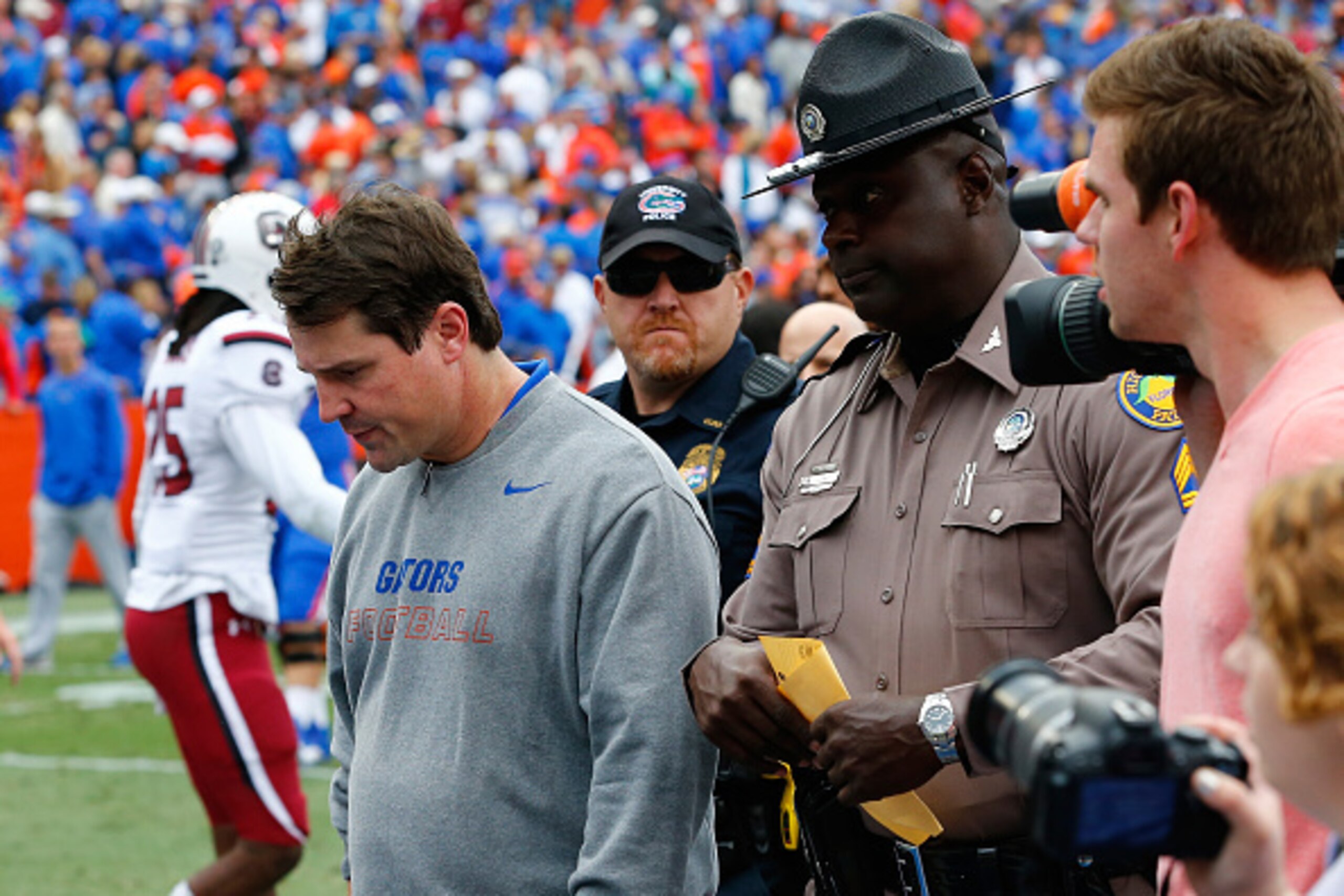 GAINESVILLE, FL - NOVEMBER 15:  Head coach Will Muschamp of the Florida Gators walks off the field after an overtime loss to the South Carolina Gamecocks at Ben Hill Griffin Stadium on November 15, 2014 in Gainesville, Florida. The Gamecocks won 23-20. (P
