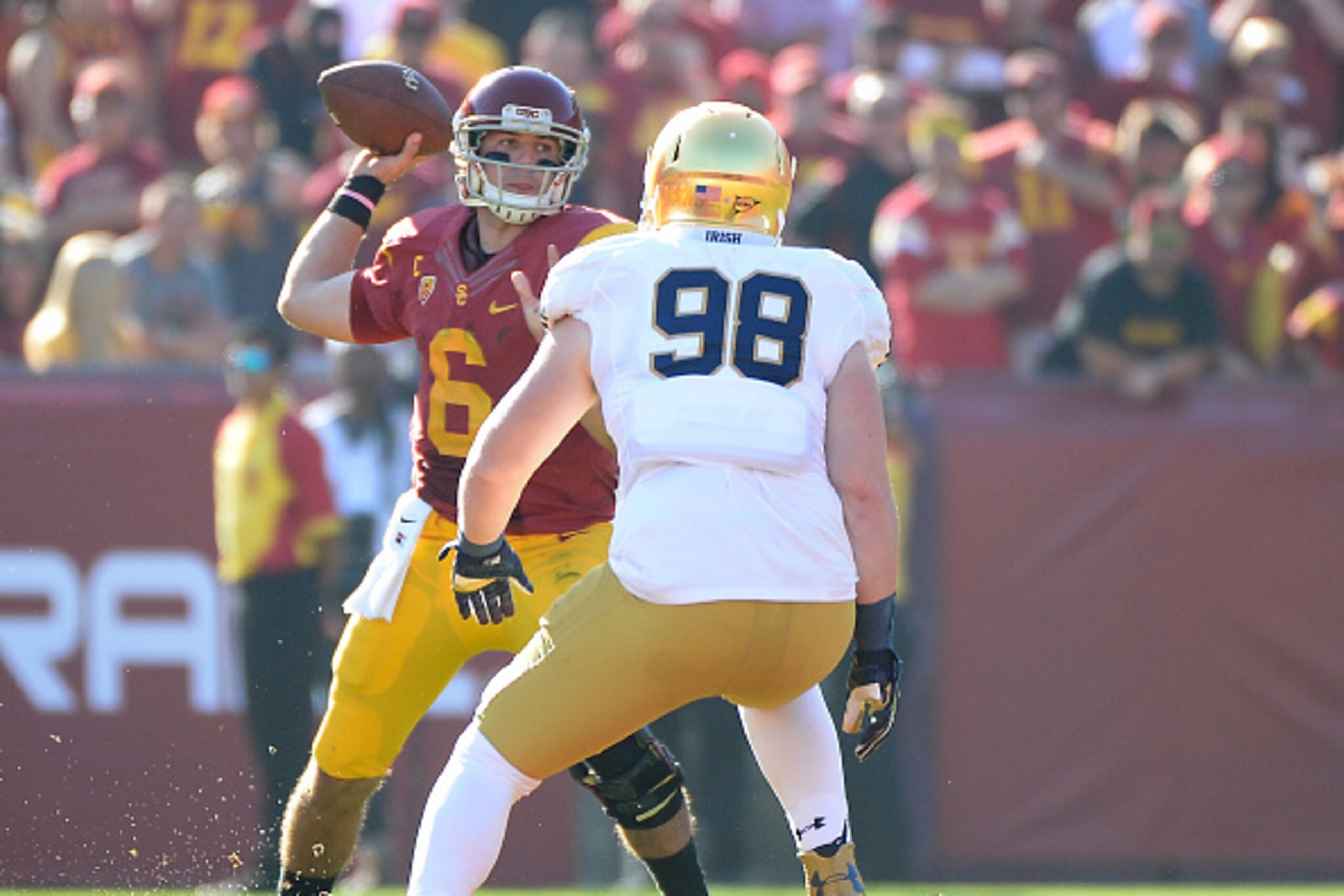 LOS ANGELES, CA - NOVEMBER 29:  Cody Kessler #6 of the USC Trojans makes a pass in front of Andrew Trumbetti #98 of the Notre Dame Fighting Irish during the second quarter at Los Angeles Memorial Coliseum on November 29, 2014 in Los Angeles, California.  