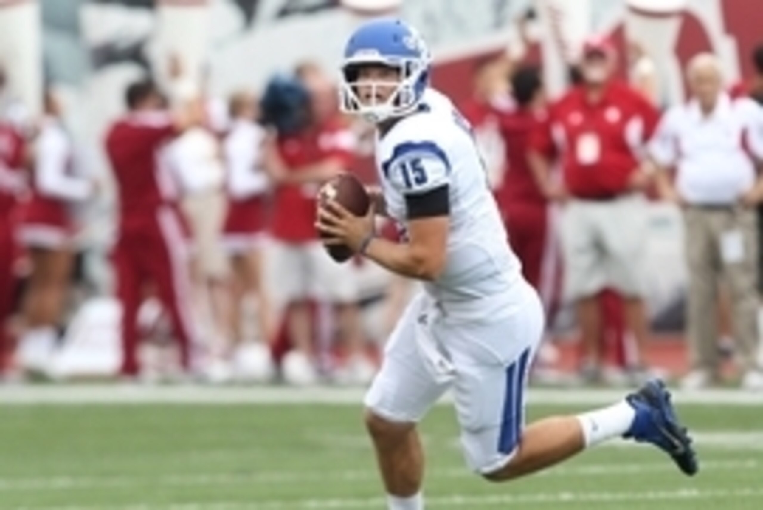Aug 30, 2014; Bloomington, IN, USA;  Indiana State Sycamores quarterback Mike Perish (15) scrambles with the ball during the first quarter against the Indiana Hoosiers at Memorial Stadium. Mandatory Credit: Pat Lovell-USA TODAY Sports