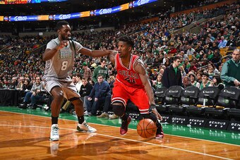 BOSTON, MA - NOVEMBER 28:  Jimmy Butler #21 of the Chicago Bulls handles the ball against Jeff Green #8 of the Boston Celtics on November 28, 2014 at the TD Garden in Boston, Massachusetts. NOTE TO USER: User expressly acknowledges and agrees that, by dow