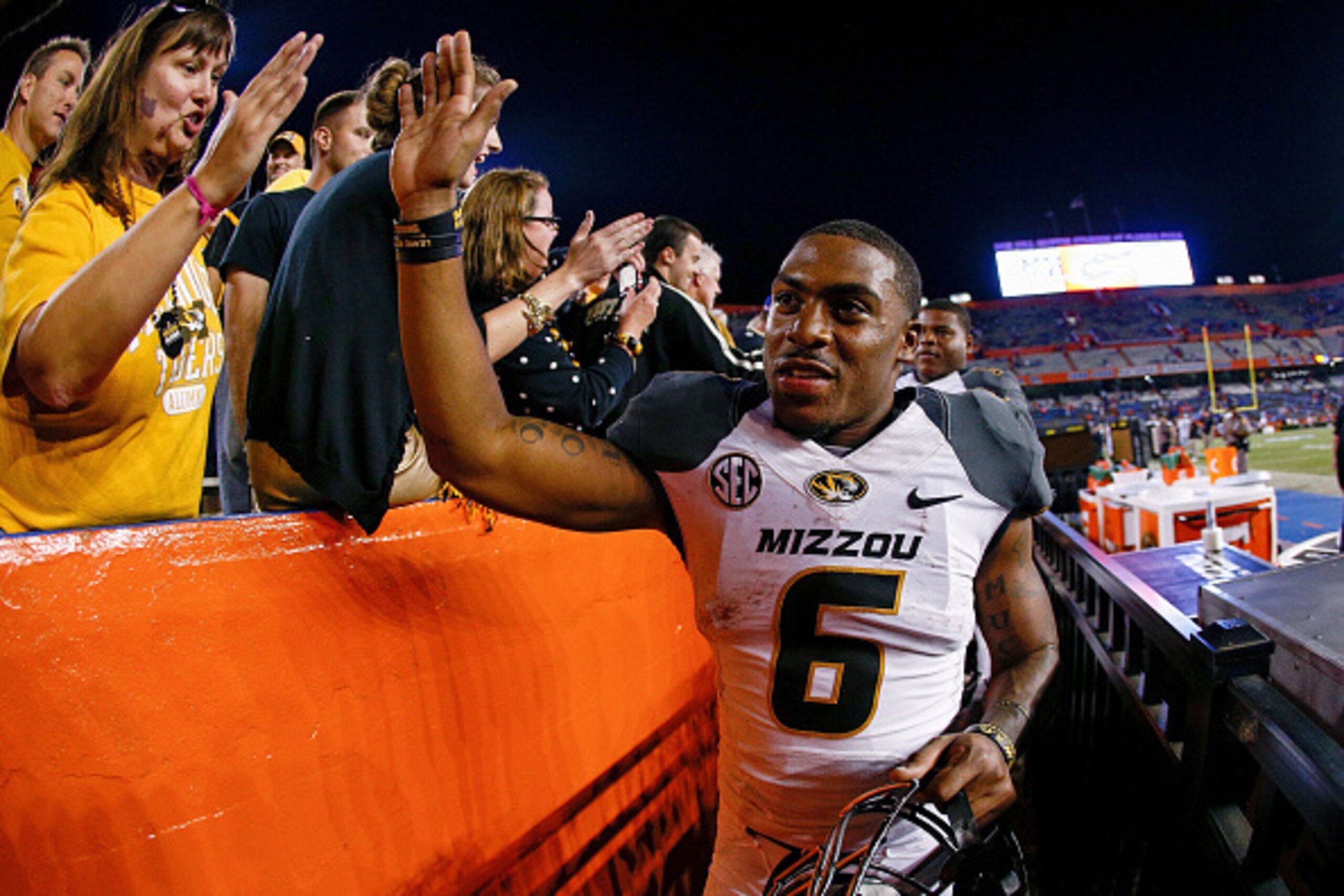 GAINESVILLE, FL - OCTOBER 18: Marcus Murphy #6 of the Missouri Tigers runs around the parameter of the field to high-five fans after the game against the Florida Gators at Ben Hill Griffin Stadium on October 18, 2014 in Gainesville, Florida. (Photo by Ro GAINESVILLE, FL - OCTOBER 18: Marcus Murphy #6 of the Missouri Tigers runs around the parameter of the field to high-five fans after the game against the Florida Gators at Ben Hill Griffin Stadium on October 18, 2014 in Gainesville, Florida. (Photo by Ro