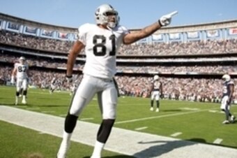 Nov 16, 2014; San Diego, CA, USA; Oakland Raiders tight end Mychal Rivera (81) signals for a first down against the San Diego Chargers during the 1st quarter at Qualcomm Stadium. Mandatory Credit: Stan Liu-USA TODAY Sports