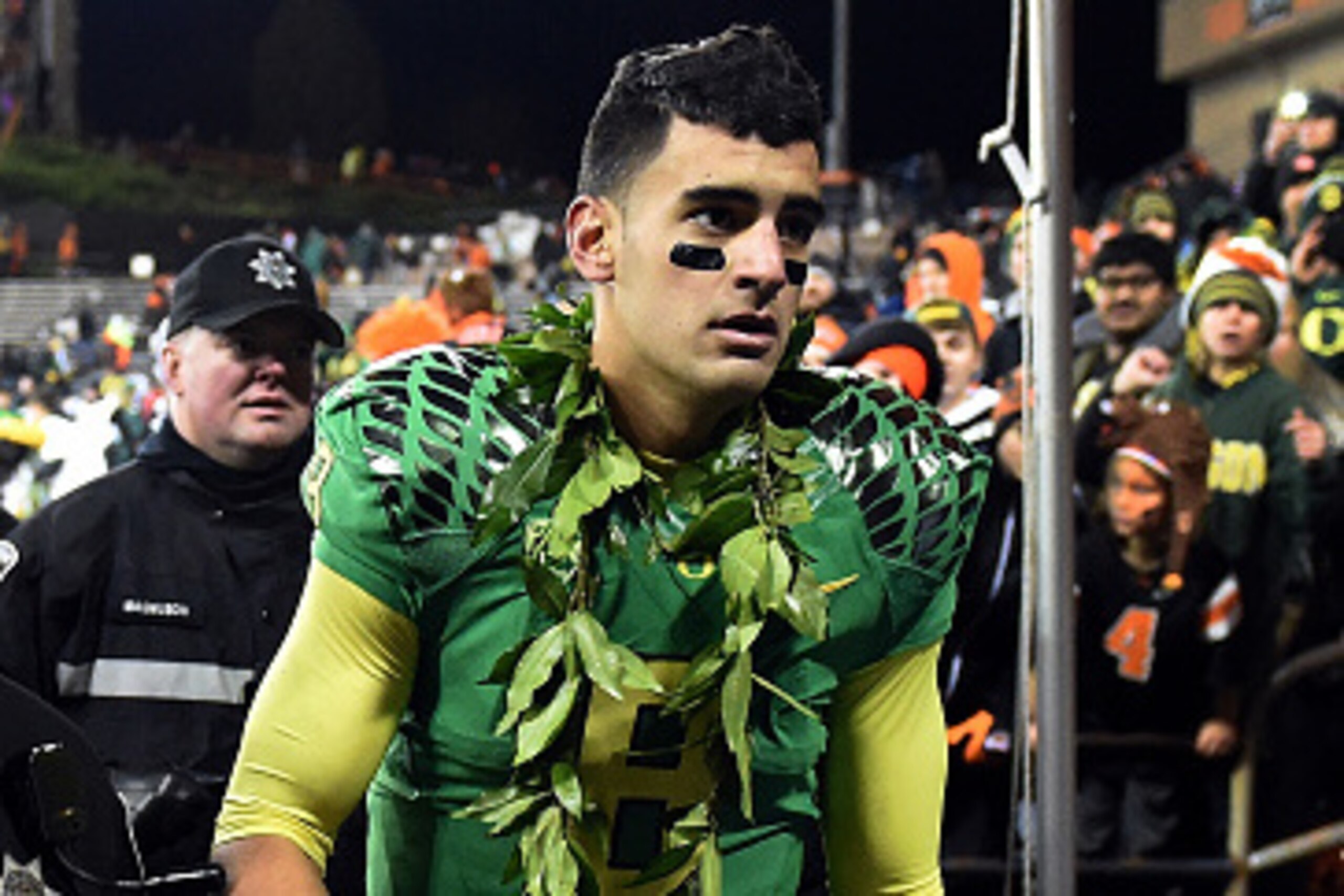 CORVALLIS, OR - NOVEMBER 29:  Quarterback Marcus Mariota #8 of the Oregon Ducks heads to the locker room after the game against the Oregon State Beavers at Reser Stadium on November 29, 2014 in Corvallis, Oregon.  (Photo by Steve Dykes/Getty Images)