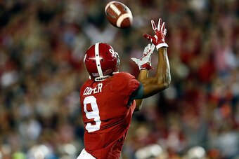TUSCALOOSA, AL - NOVEMBER 29:  Amari Cooper #9 of the Alabama Crimson Tide catches a 39 yard touchdown thrown by Blake Sims #6 in the third quarter against the Auburn Tigers during the Iron Bowl at Bryant-Denny Stadium on November 29, 2014 in Tuscaloosa, 