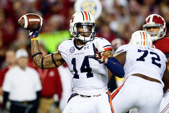 TUSCALOOSA, AL - NOVEMBER 29:  Nick Marshall #14 of the Auburn Tigers throws a pass in the second quarter against the Alabama Crimson Tide during the Iron Bowl at Bryant-Denny Stadium on November 29, 2014 in Tuscaloosa, Alabama.  (Photo by Kevin C. Cox/Ge