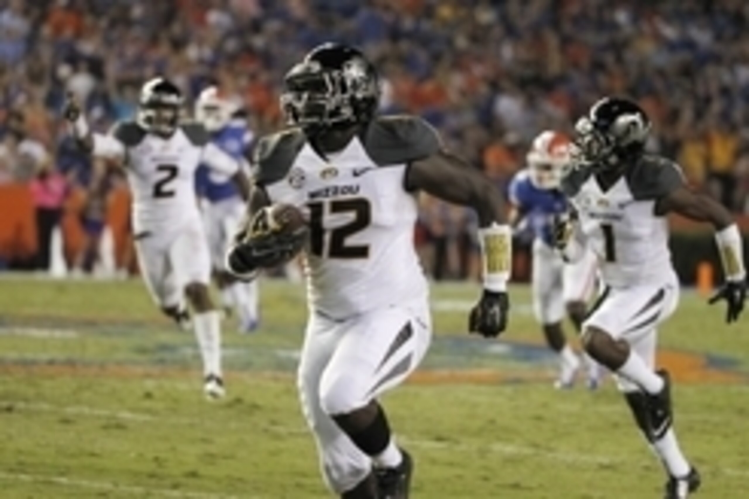 Oct 18, 2014; Gainesville, FL, USA; Missouri Tigers linebacker Darvin Ruise (12) runs the ball to score a touchdown against the Florida Gators during the second half at Ben Hill Griffin Stadium. The Tigers won 42-13. Mandatory Credit: Kim Klement-USA TODA
