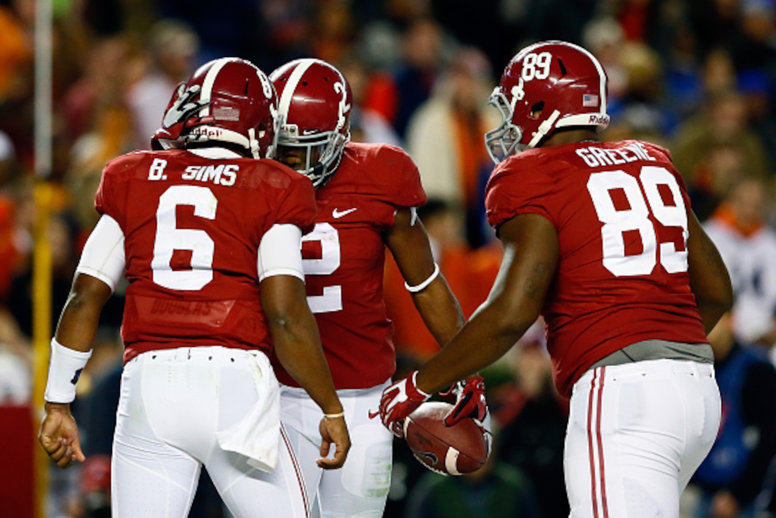 TUSCALOOSA, AL - NOVEMBER 29:  Blake Sims #6 of the Alabama Crimson Tide celebrates with his teammates DeAndrew White #2 and Armani Purifoye #89 in the fourth quarter against the Auburn Tigers during the Iron Bowl at Bryant-Denny Stadium on November 29, 2