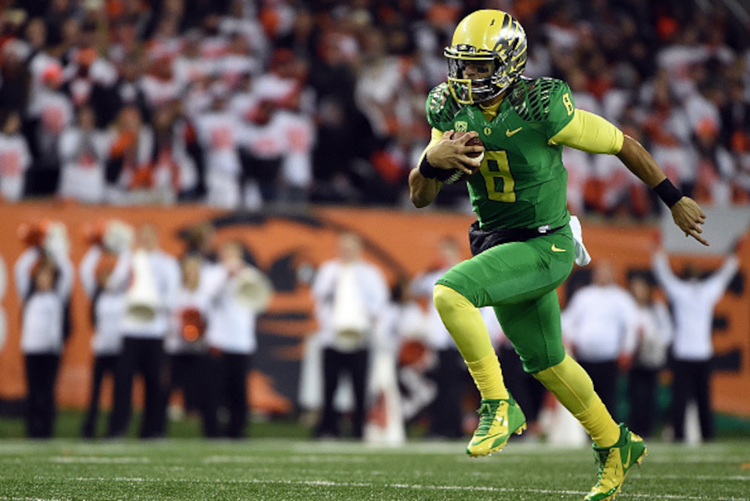 CORVALLIS, OR - NOVEMBER 29:  Quarterback Marcus Mariota #8 of the Oregon Ducks runs with the ball during the first quarter of the game against the Oregon State Beavers at Reser Stadium on November 29, 2014 in Corvallis, Oregon.  (Photo by Steve Dykes/Get