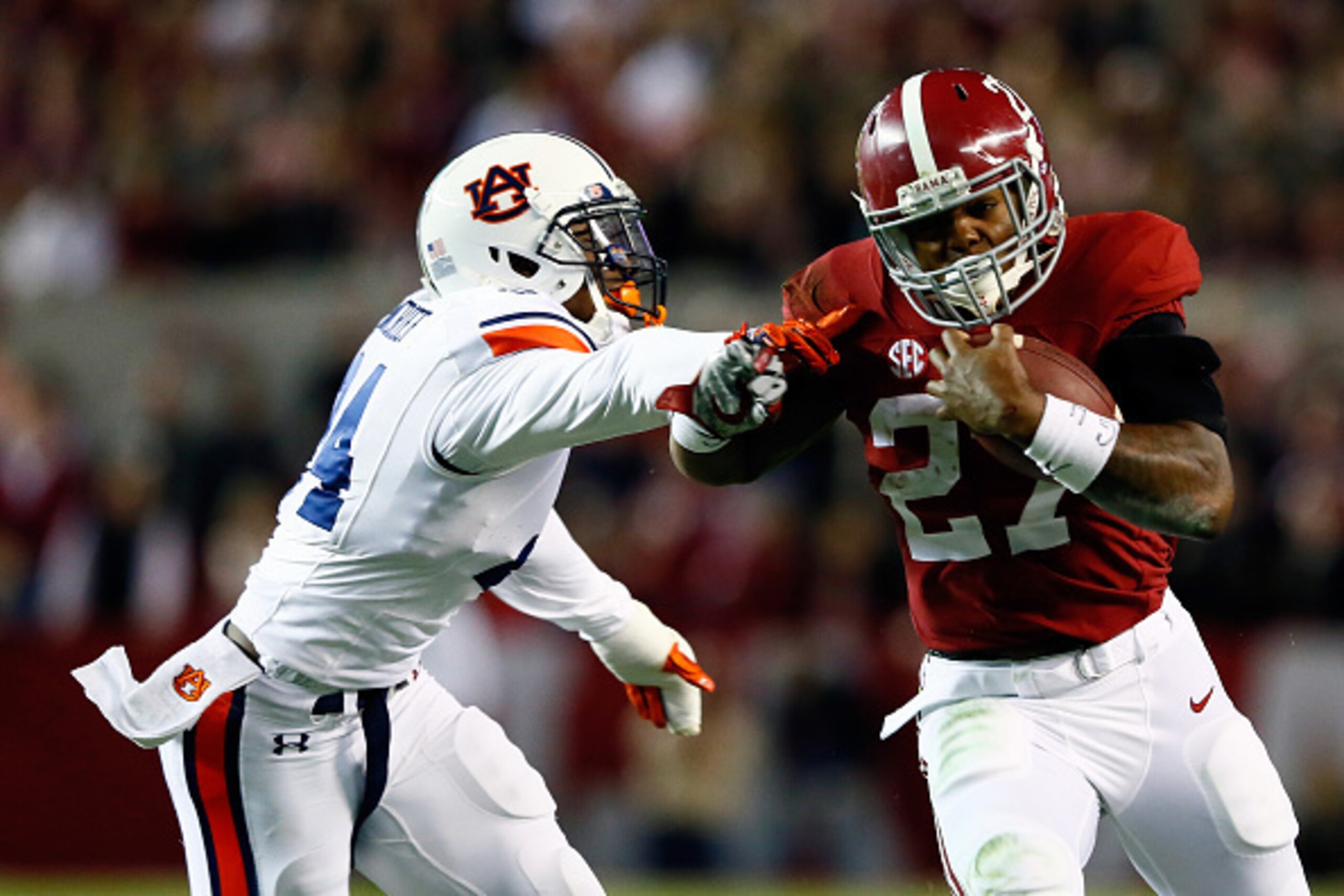 TUSCALOOSA, AL - NOVEMBER 29:  Derrick Henry #27 of the Alabama Crimson Tide runs the ball in the fourth quarter against the Auburn Tigers during the Iron Bowl at Bryant-Denny Stadium on November 29, 2014 in Tuscaloosa, Alabama.  (Photo by Kevin C. Cox/Ge