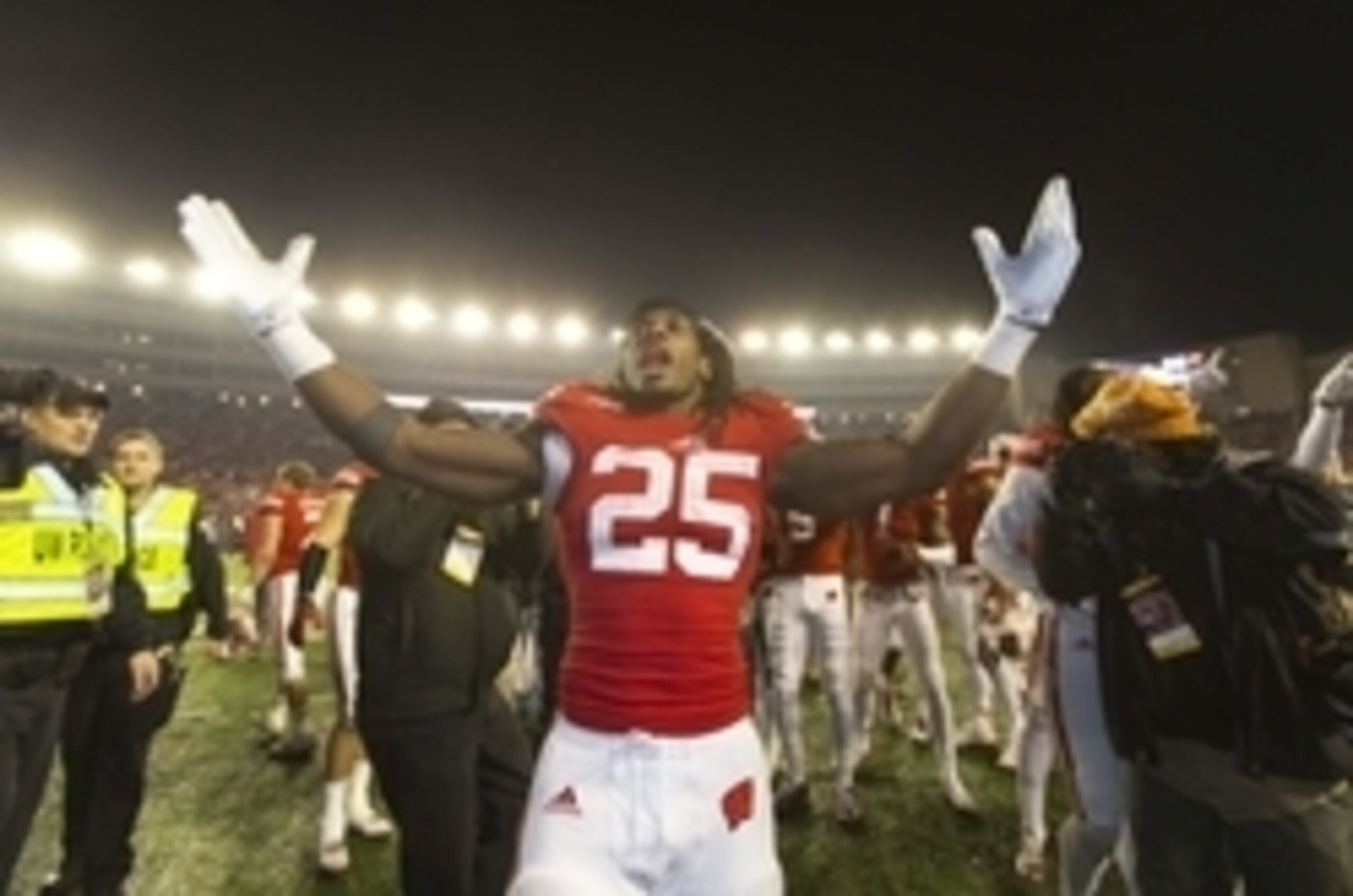 Nov 29, 2014; Madison, WI, USA; Wisconsin Badgers running back Melvin Gordon (25) celebrates following the game against the Minnesota Golden Gophers at Camp Randall Stadium.   Wisconsin won 34-24.  Mandatory Credit: Jeff Hanisch-USA TODAY Sports