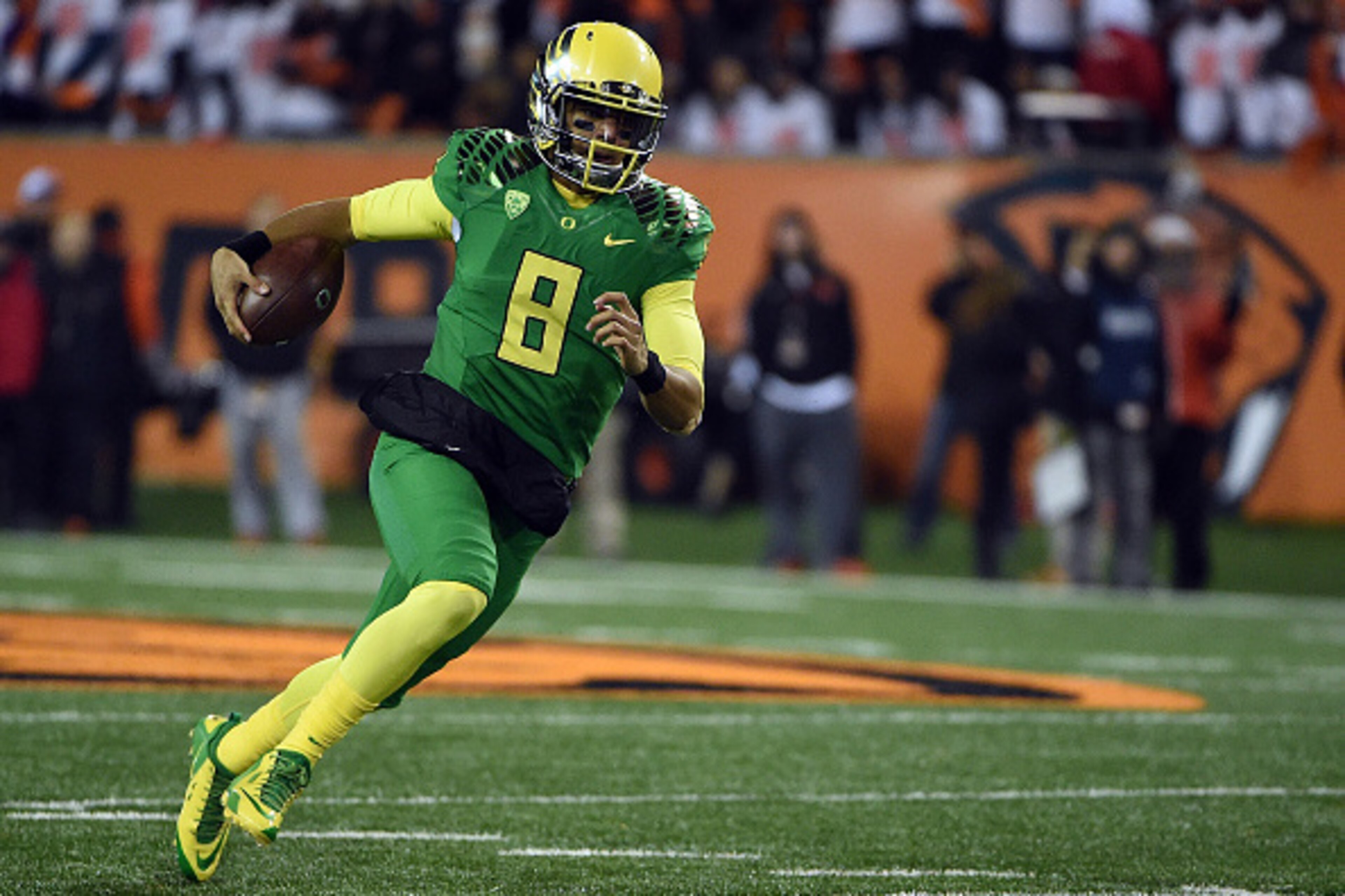 CORVALLIS, OR - NOVEMBER 29:  Quarterback Marcus Mariota #8 of the Oregon Ducks runs with the ball during the third quarter of the game against the Oregon State Beavers at Reser Stadium on November 29, 2014 in Corvallis, Oregon.  (Photo by Steve Dykes/Get