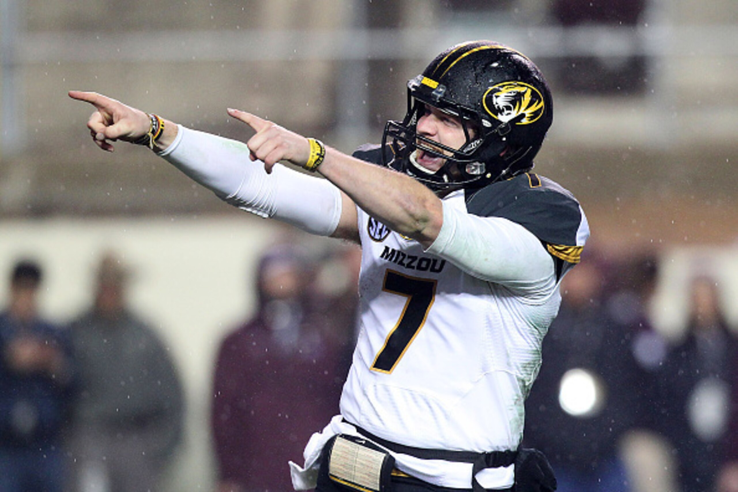 HOUSTON, TX - NOVEMBER 15: Maty Mauk #7 of the Missouri Tigers points to the Missouri Tigers fans after the Tigers defeated the Texas A&M Aggies  in an NCAA football game on November 15, 2014 at Kyle Field in College Station, Texas. The Tigers won 34-27. 