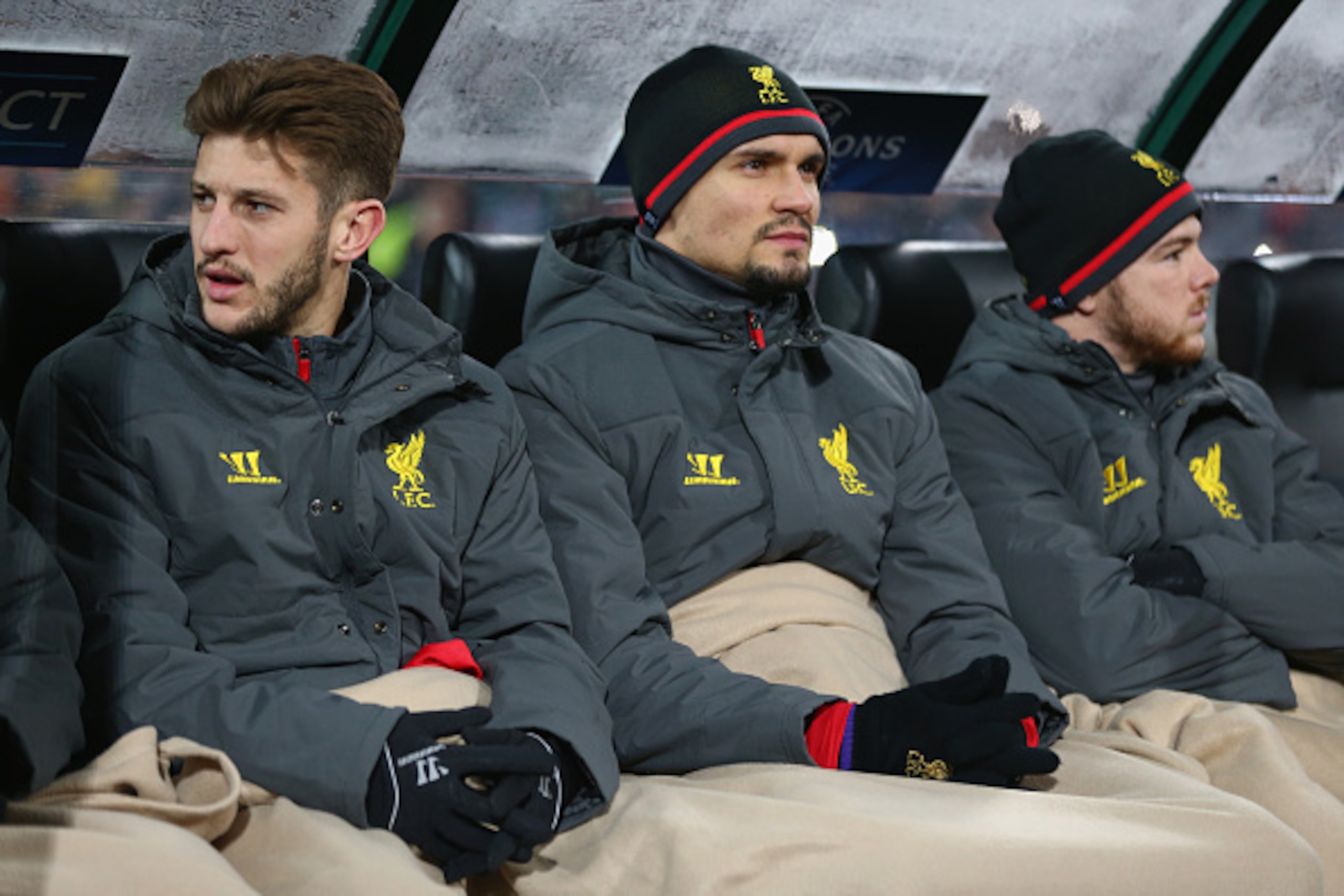 SOFIA, BULGARIA - NOVEMBER 26: Adam Lallana (L), Dejan Lovren (C) and Alberto Moreno (R) of Liverpool wrapped up warm on the substitutes bench during the UEFA Champions League Group B match between Ludogorets Razgrad and Liverpool at the Vasil Levski Sta SOFIA, BULGARIA - NOVEMBER 26: Adam Lallana (L), Dejan Lovren (C) and Alberto Moreno (R) of Liverpool wrapped up warm on the substitutes bench during the UEFA Champions League Group B match between Ludogorets Razgrad and Liverpool at the Vasil Levski Sta