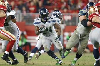 SANTA CLARA, CA - NOVEMBER 27:  Marshawn Lynch #24 of the Seattle Seahawks runs up the middle against the San Francisco 49ers in the fourth quarter at Levi's Stadium on November 27, 2014 in Santa Clara, California.  (Photo by Brian Bahr/Getty Images)