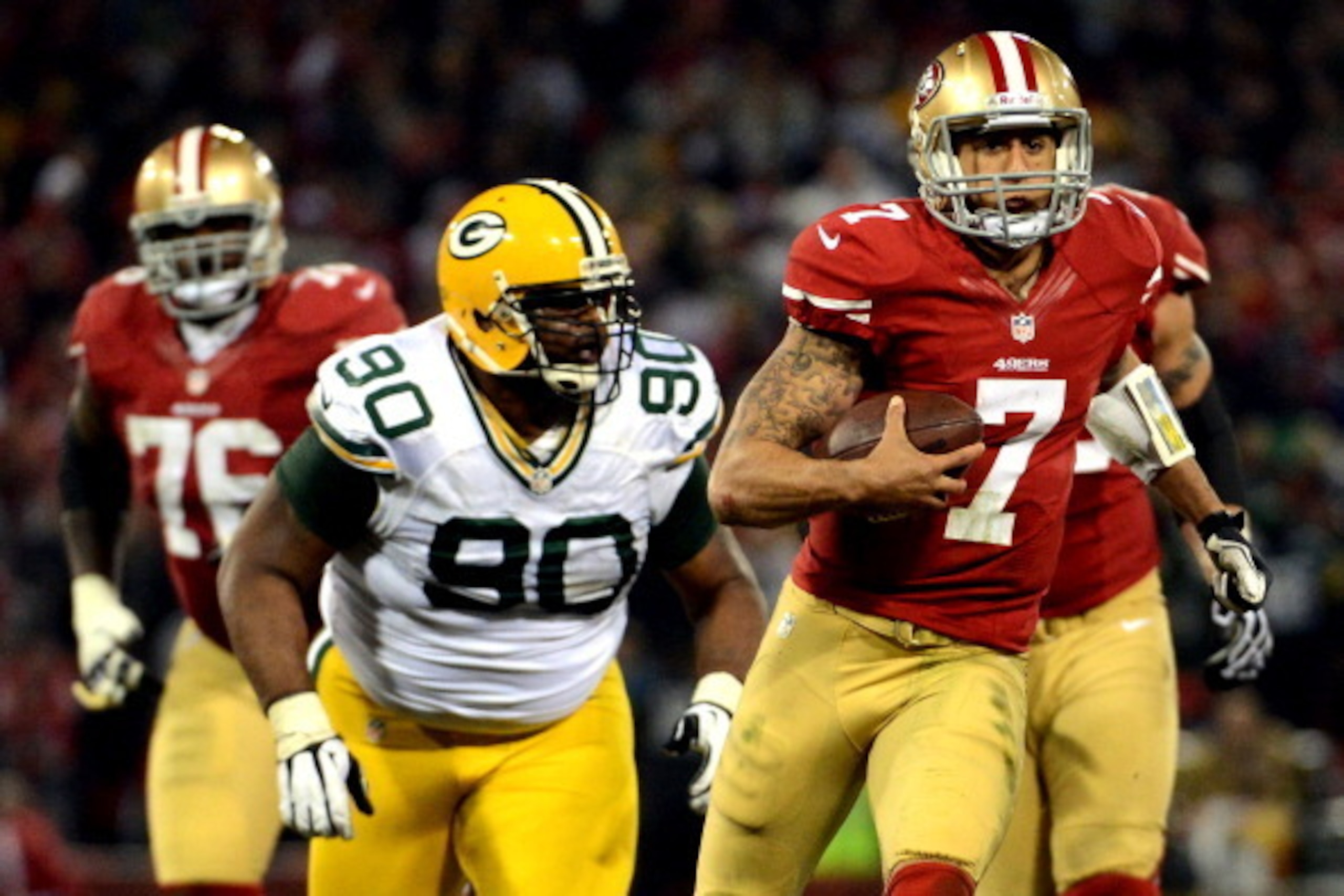 SAN FRANCISCO, CA - JANUARY 12: Quarterback Colin Kaepernick #7 of the San Francisco 49ers runs the ball against nose tackle B.J. Raji #90 of the Green Bay Packers during the NFC Divisional Playoff Game at Candlestick Park on January 12, 2013 in San Fran SAN FRANCISCO, CA - JANUARY 12: Quarterback Colin Kaepernick #7 of the San Francisco 49ers runs the ball against nose tackle B.J. Raji #90 of the Green Bay Packers during the NFC Divisional Playoff Game at Candlestick Park on January 12, 2013 in San Fran