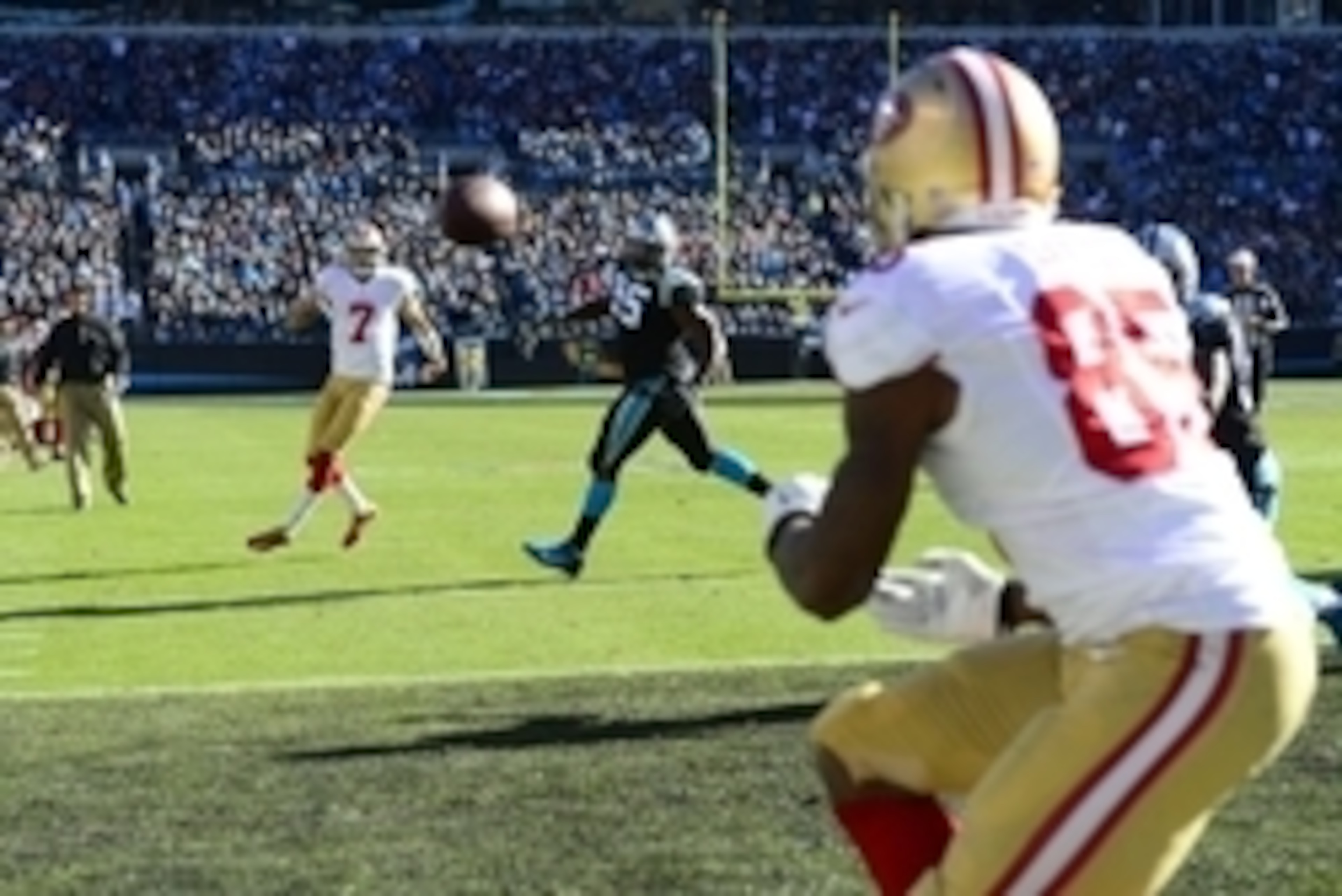 Jan 12, 2014; Charlotte, NC, USA; San Francisco 49ers quarterback Colin Kaepernick (7) throws a touchdown to tight end Vernon Davis (85) against the Carolina Panthers during the second quarter of the 2013 NFC divisional playoff football game at Bank of Am