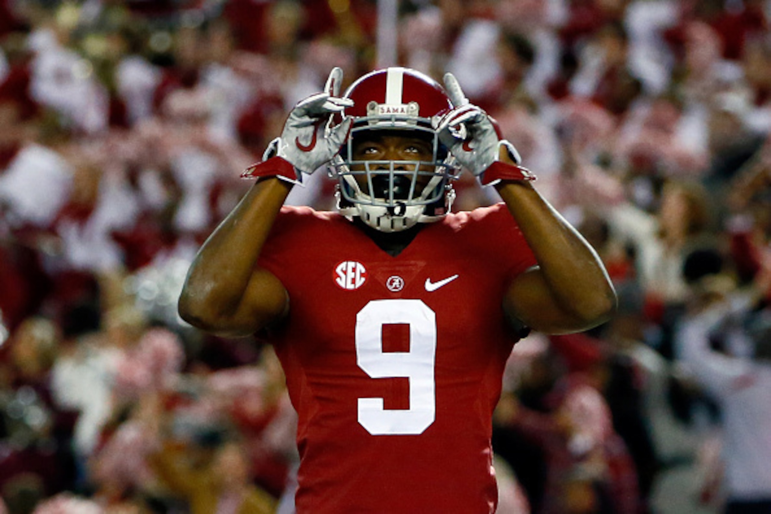 TUSCALOOSA, AL - NOVEMBER 29:  Amari Cooper #9 of the Alabama Crimson Tide celebrates after catching a 39 yard touchdown pass thrown by Blake Sims #6 in the third quarter against the Auburn Tigers during the Iron Bowl at Bryant-Denny Stadium on November 2