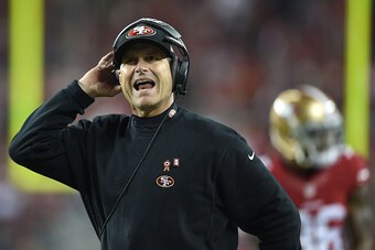 SANTA CLARA, CA - NOVEMBER 27:  Head coach Jim Harbaugh of the San Francisco 49ers argues a call against the Seattle Seahawks in the first half at Levi's Stadium on November 27, 2014 in Santa Clara, California.  (Photo by Thearon W. Henderson/Getty Images