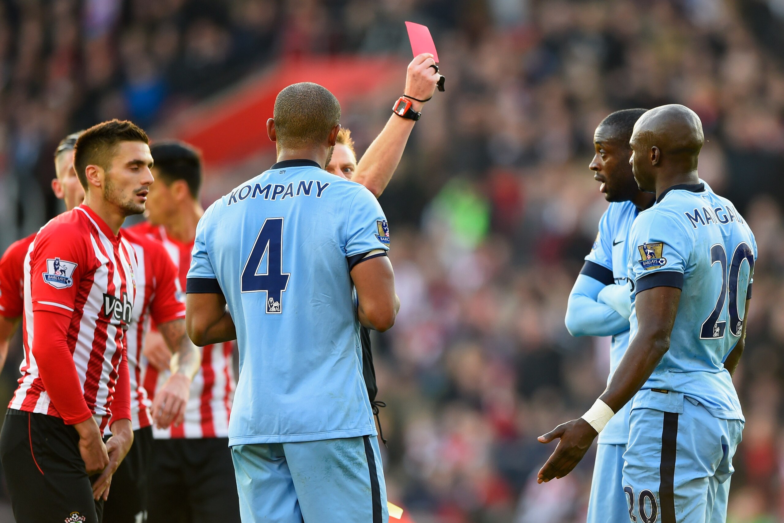 SOUTHAMPTON, ENGLAND - NOVEMBER 30: Eliaquim Mangala of Manchester City (20) is shown a red card by referee Mike Jones and is sent off during the Barclays Premier League match between Southampton and Manchester City at St Mary's Stadium on November 30, 2 SOUTHAMPTON, ENGLAND - NOVEMBER 30: Eliaquim Mangala of Manchester City (20) is shown a red card by referee Mike Jones and is sent off during the Barclays Premier League match between Southampton and Manchester City at St Mary's Stadium on November 30, 2