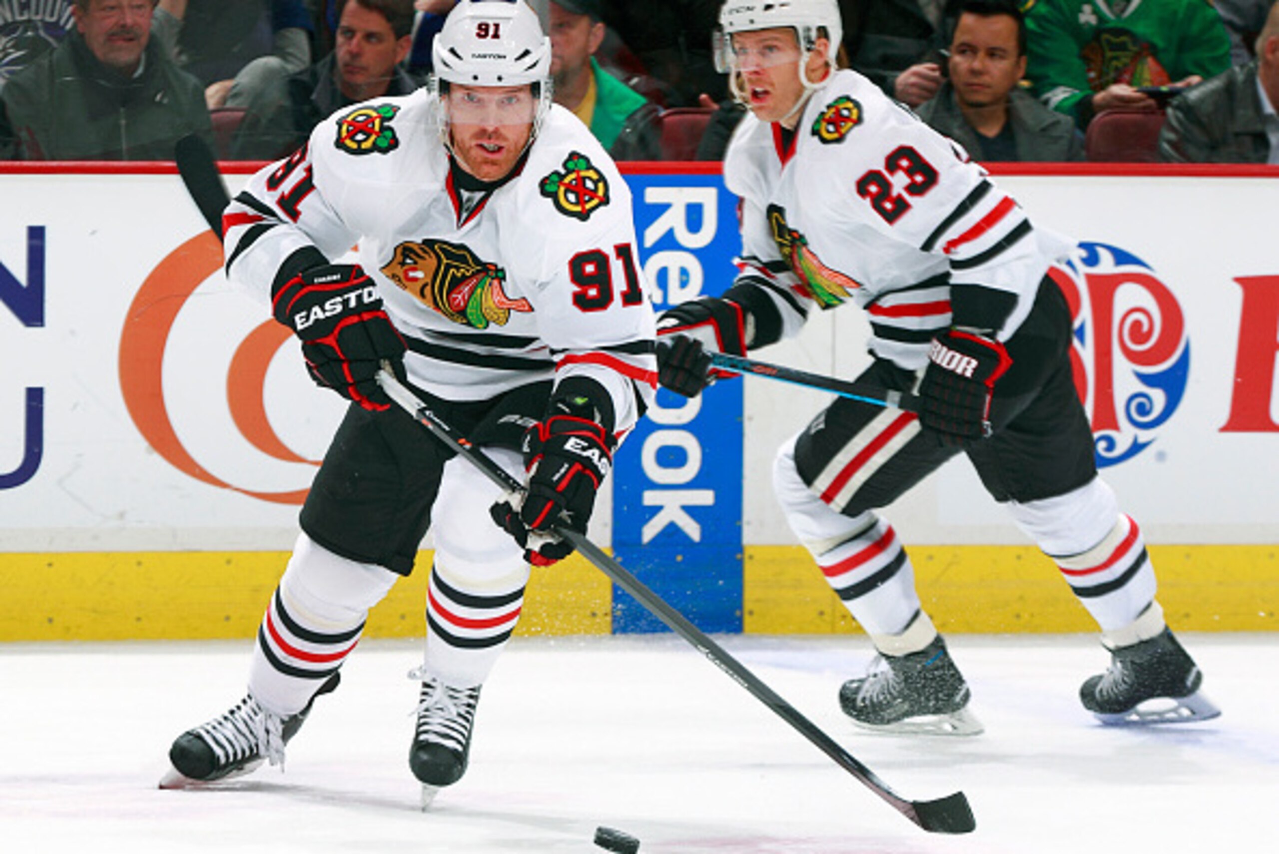 VANCOUVER, BC - NOVEMBER 23: Kris Versteeg #23 looks on as Brad Richards #91 of the Chicago Blackhawks skates up ice with the puck during their NHL game against the Vancouver Canucks at Rogers Arena November 23, 2014 in Vancouver, British Columbia, Canad VANCOUVER, BC - NOVEMBER 23: Kris Versteeg #23 looks on as Brad Richards #91 of the Chicago Blackhawks skates up ice with the puck during their NHL game against the Vancouver Canucks at Rogers Arena November 23, 2014 in Vancouver, British Columbia, Canad