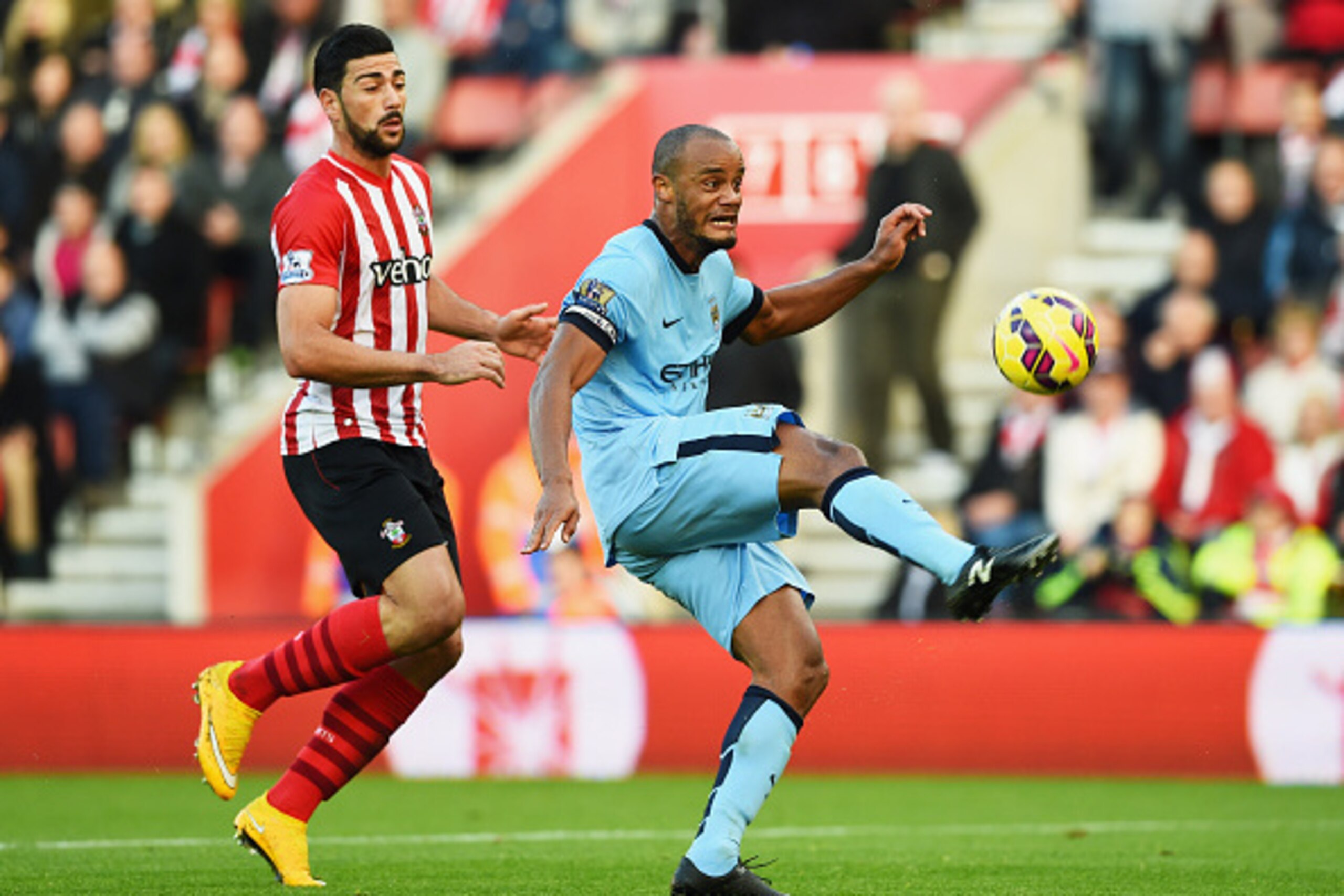 SOUTHAMPTON, ENGLAND - NOVEMBER 30: Vincent Kompany of Manchester City clears the ball from Graziano Pelle of Southampton during the Barclays Premier League match between Southampton and Manchester City at St Mary's Stadium on November 30, 2014 in Southa SOUTHAMPTON, ENGLAND - NOVEMBER 30: Vincent Kompany of Manchester City clears the ball from Graziano Pelle of Southampton during the Barclays Premier League match between Southampton and Manchester City at St Mary's Stadium on November 30, 2014 in Southa
