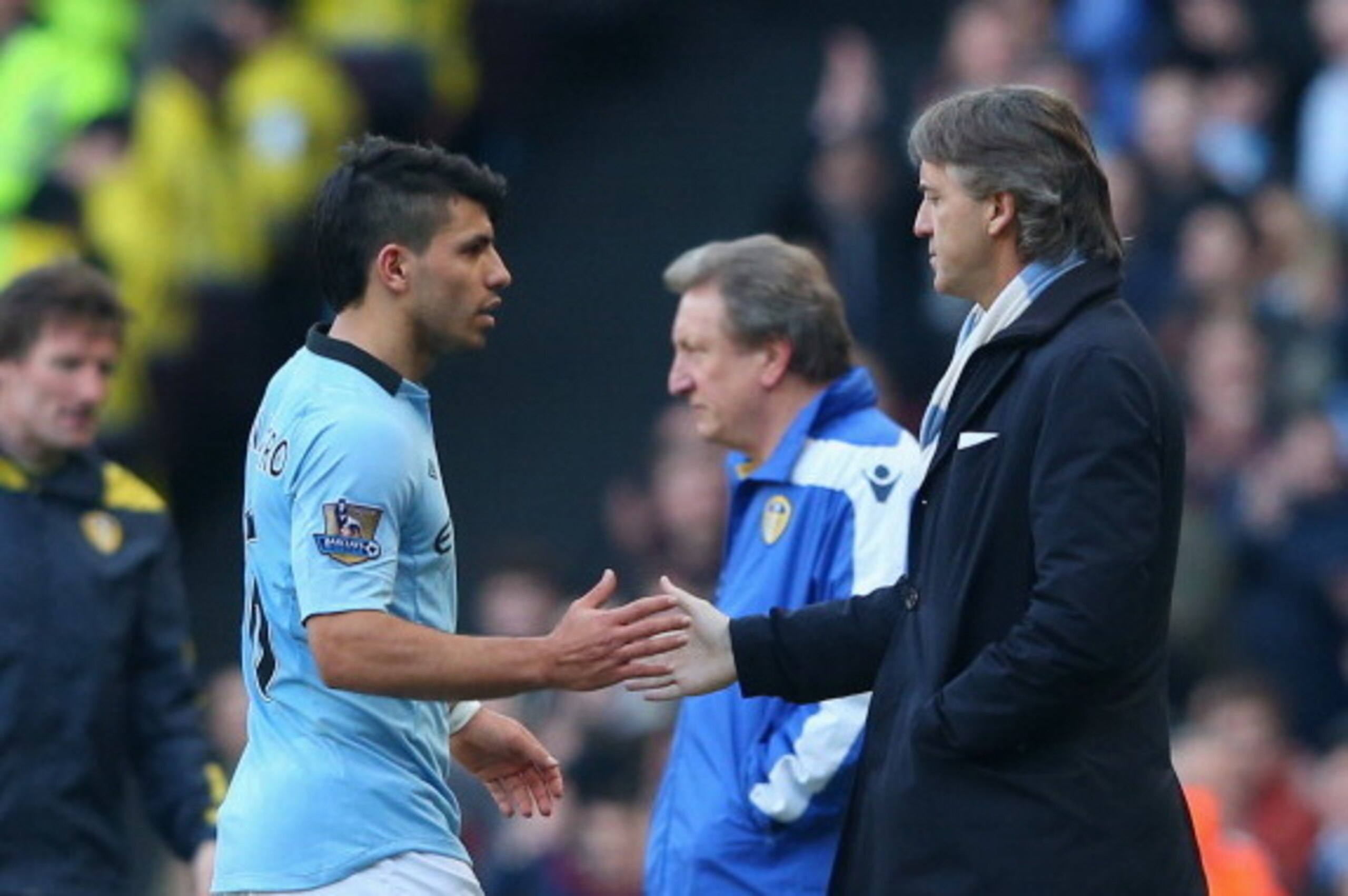 MANCHESTER, ENGLAND - FEBRUARY 17:  Manchester City Manager Roberto Mancini congratulates Sergio Aguero as he is substituted during the FA Cup with Budweiser Fifth Round match between Manchester City and Leeds United at the Etihad Stadium on February 17, 