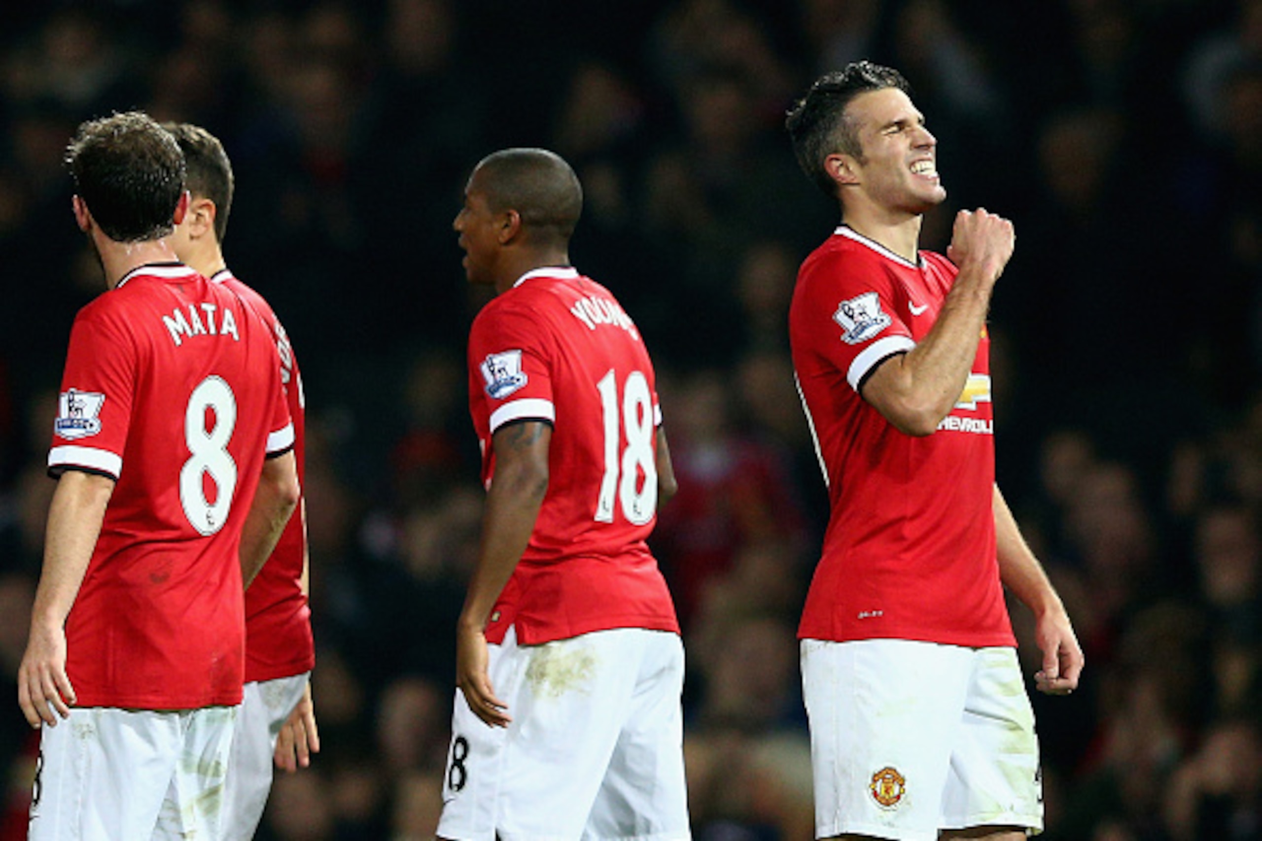 MANCHESTER, ENGLAND - NOVEMBER 29:  Robin van Persie of Manchester United (R) celebrates scoring their third goal with team mates during the Barclays Premier League match between Manchester United and Hull City at Old Trafford on November 29, 2014 in Manc