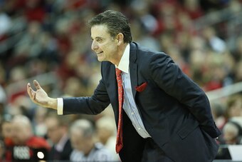 LOUISVILLE, KY - NOVEMBER 26:  Rick Pitino the head coach of the Louisville Cardinals gives instructions to his team during the game against the Cleveland State Vikings at KFC YUM! Center on November 26, 2014 in Louisville, Kentucky.  With tonights 45-33 