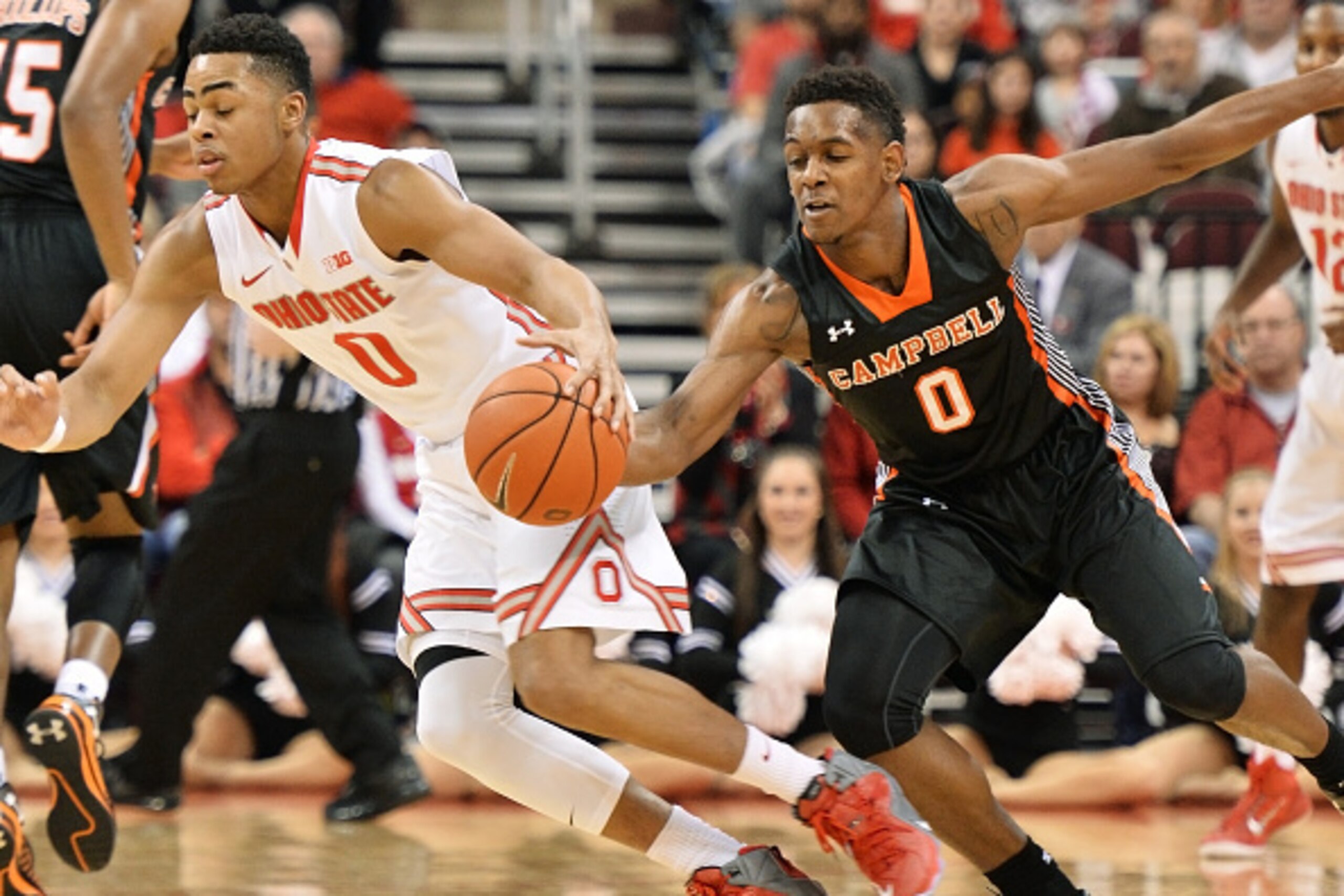 COLUMBUS, OH - NOVEMBER 26:  Kyre' Hamer #0 of the Campbell Fighting Camels fouls D'Angelo Russell #0 of the Ohio State Buckeyes as he attempts to steal the ball in the first half on November 26, 2014 at Value City Arena in Columbus, Ohio.  (Photo by Jami
