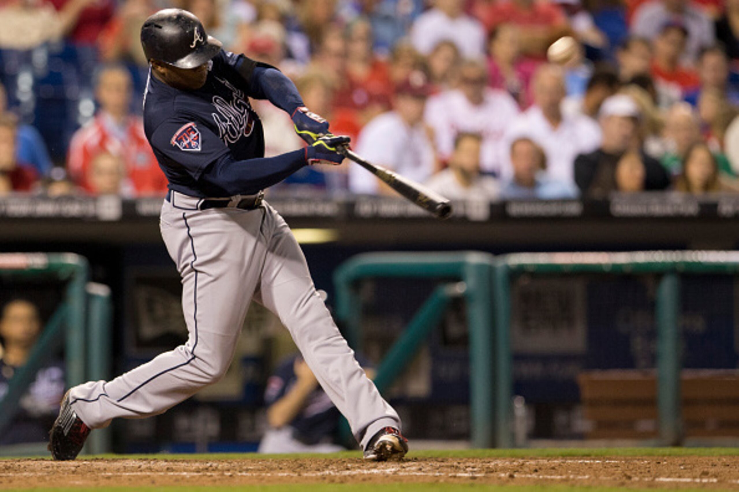 PHILADELPHIA, PA - SEPTEMBER 27: Left fielder Justin Upton #8 of the Atlanta Braves hits a two run home run in the top of the seventh inning against the Philadelphia Phillies on September 27, 2014 at Citizens Bank Park in Philadelphia, Pennsylvania. The B