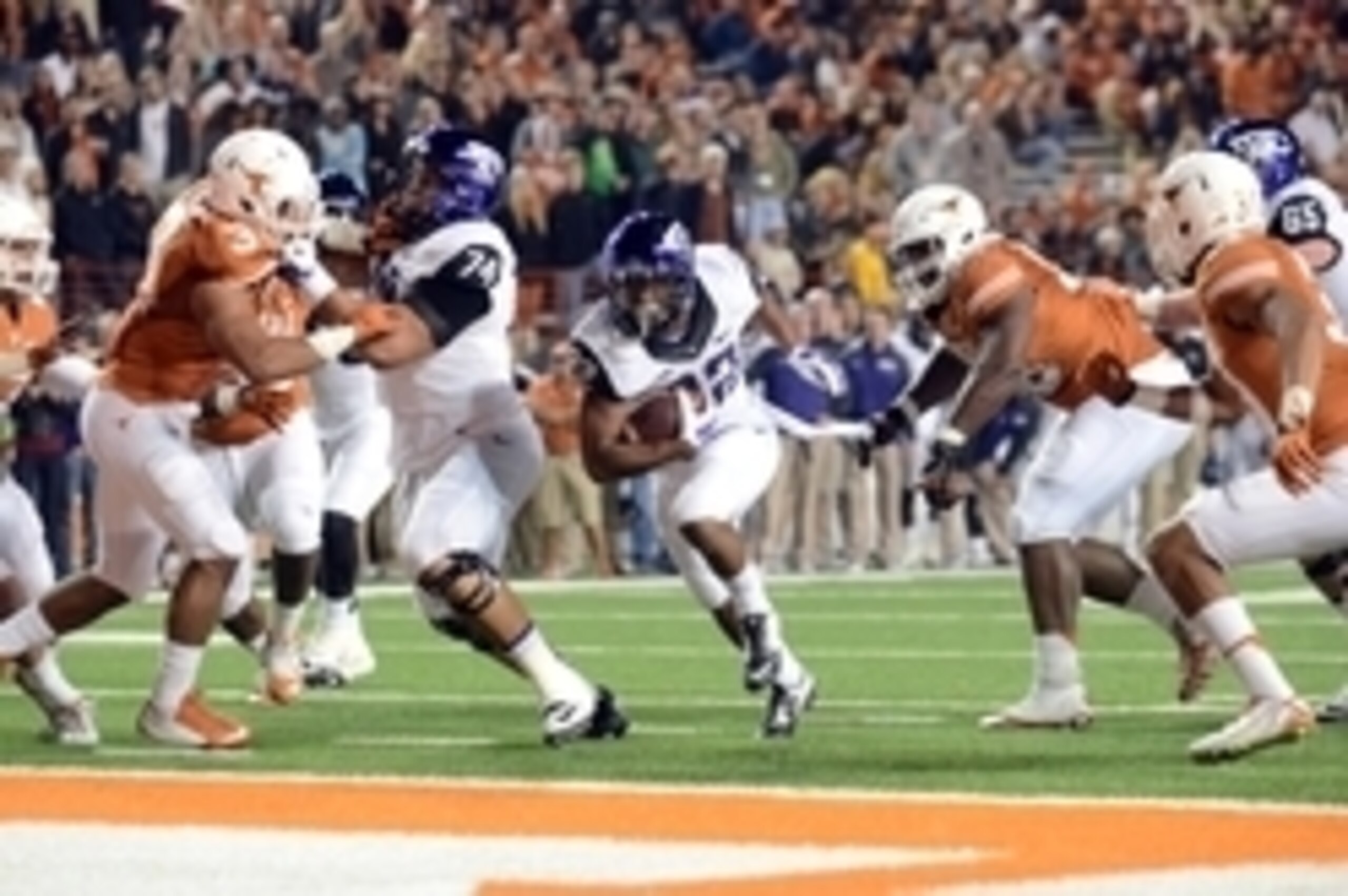 Nov 27, 2014; Austin, TX, USA; TCU Horned Frogs running back Aaron Green (22) scores a touchdown against the Texas Longhorns during the game at Darrell K Royal-Texas Memorial Stadium. Mandatory Credit: Brendan Maloney-USA TODAY Sports Nov 27, 2014; Austin, TX, USA; TCU Horned Frogs running back Aaron Green (22) scores a touchdown against the Texas Longhorns during the game at Darrell K Royal-Texas Memorial Stadium. Mandatory Credit: Brendan Maloney-USA TODAY Sports