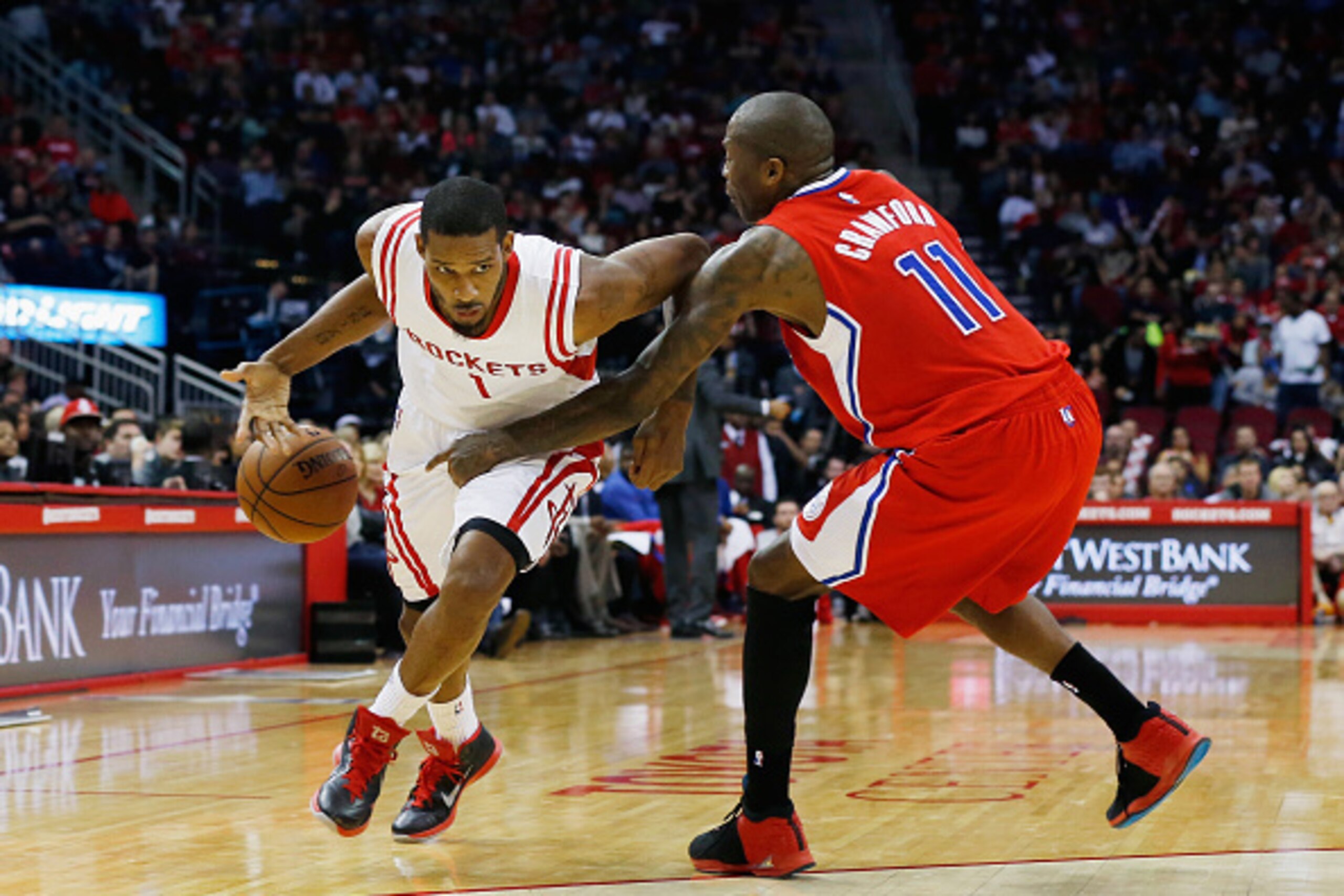 HOUSTON, TX - NOVEMBER 28:  Trevor Ariza #1 of the Houston Rockets gets the ball stolen by Jamal Crawford #11 of the Los Angeles Clippers during their game at the Toyota Center on November 28, 2014 in Houston, Texas.  NOTE TO USER: User expressly acknowle