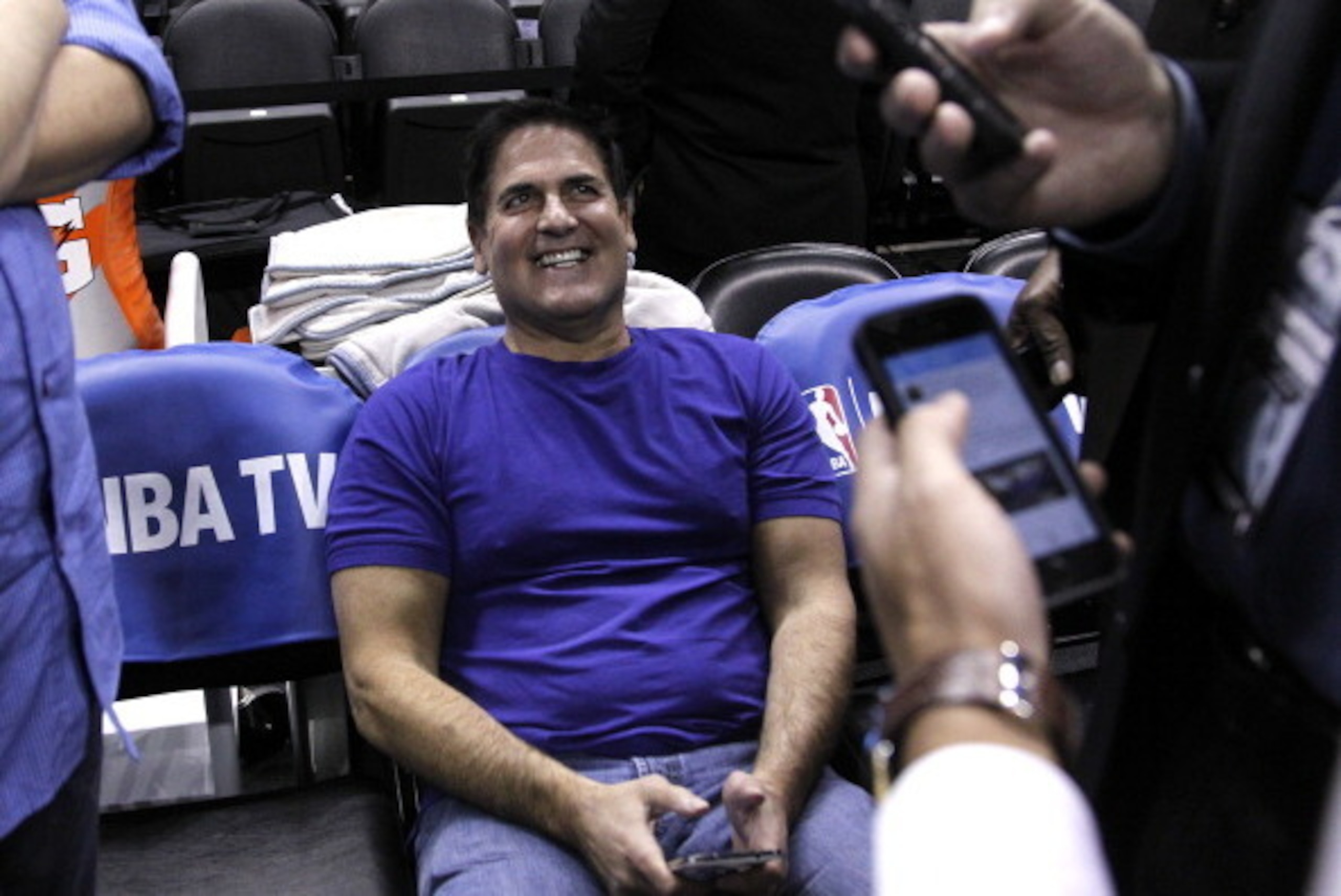 SAN ANTONIO, TX - APRIL 23: Mark Cuban owner of the Dallas Mavericks waits for a reaction from reporters after sending a tweet before his team plays the San Antonio Spurs in Game Two of the Western Conference Quarterfinals during the 2014 NBA Playoffs at 