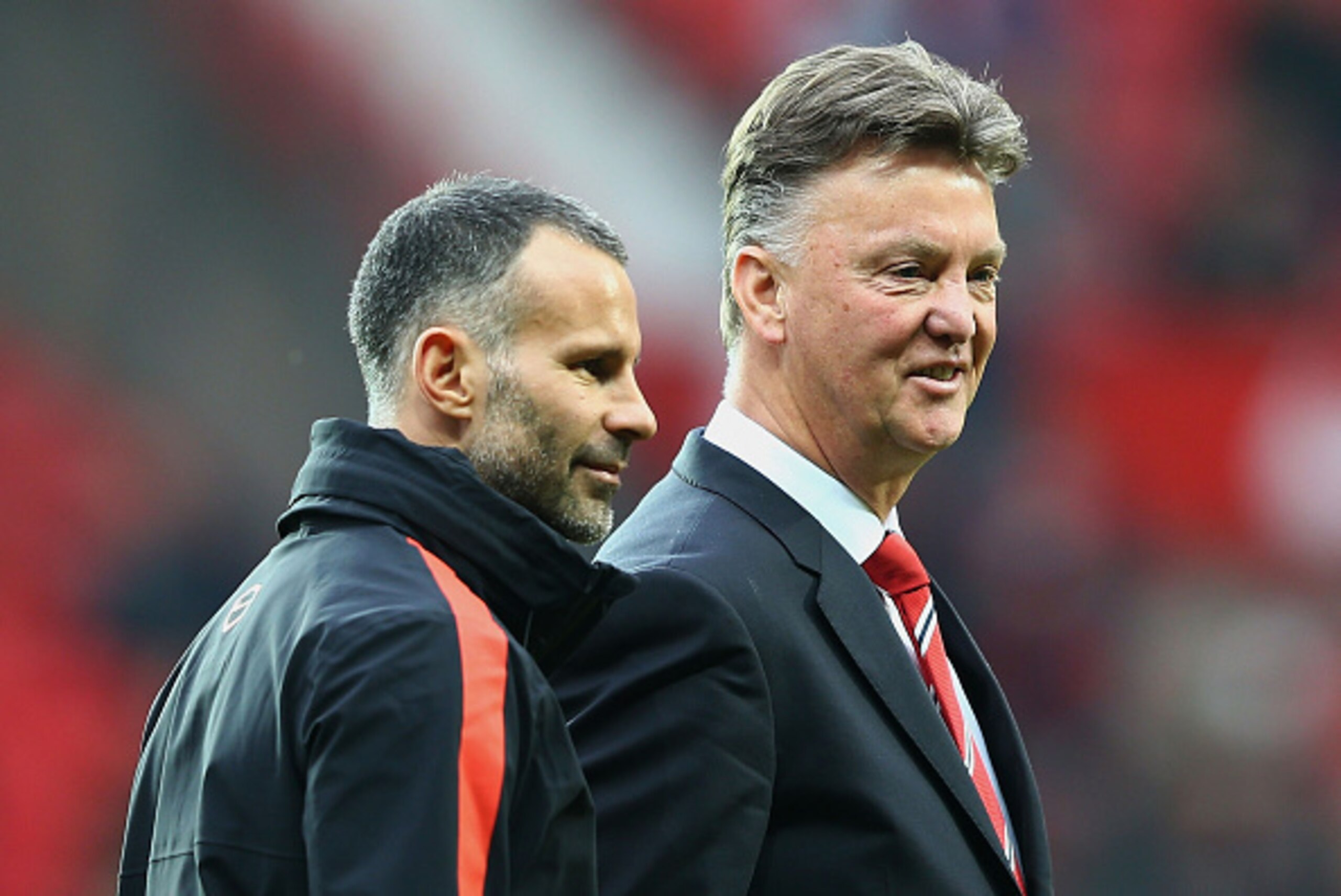 MANCHESTER, ENGLAND - NOVEMBER 29:  Louis van Gaal manager of Manchester United in discussion with assistant Ryan Giggs prior to the Barclays Premier League match between Manchester United and Hull City at Old Trafford on November 29, 2014 in Manchester, 