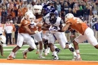 Nov 27, 2014; Austin, TX, USA; TCU Horned Frogs running back Aaron Green (22) scores a touchdown against the Texas Longhorns during the game at Darrell K Royal-Texas Memorial Stadium. Mandatory Credit: Brendan Maloney-USA TODAY Sports