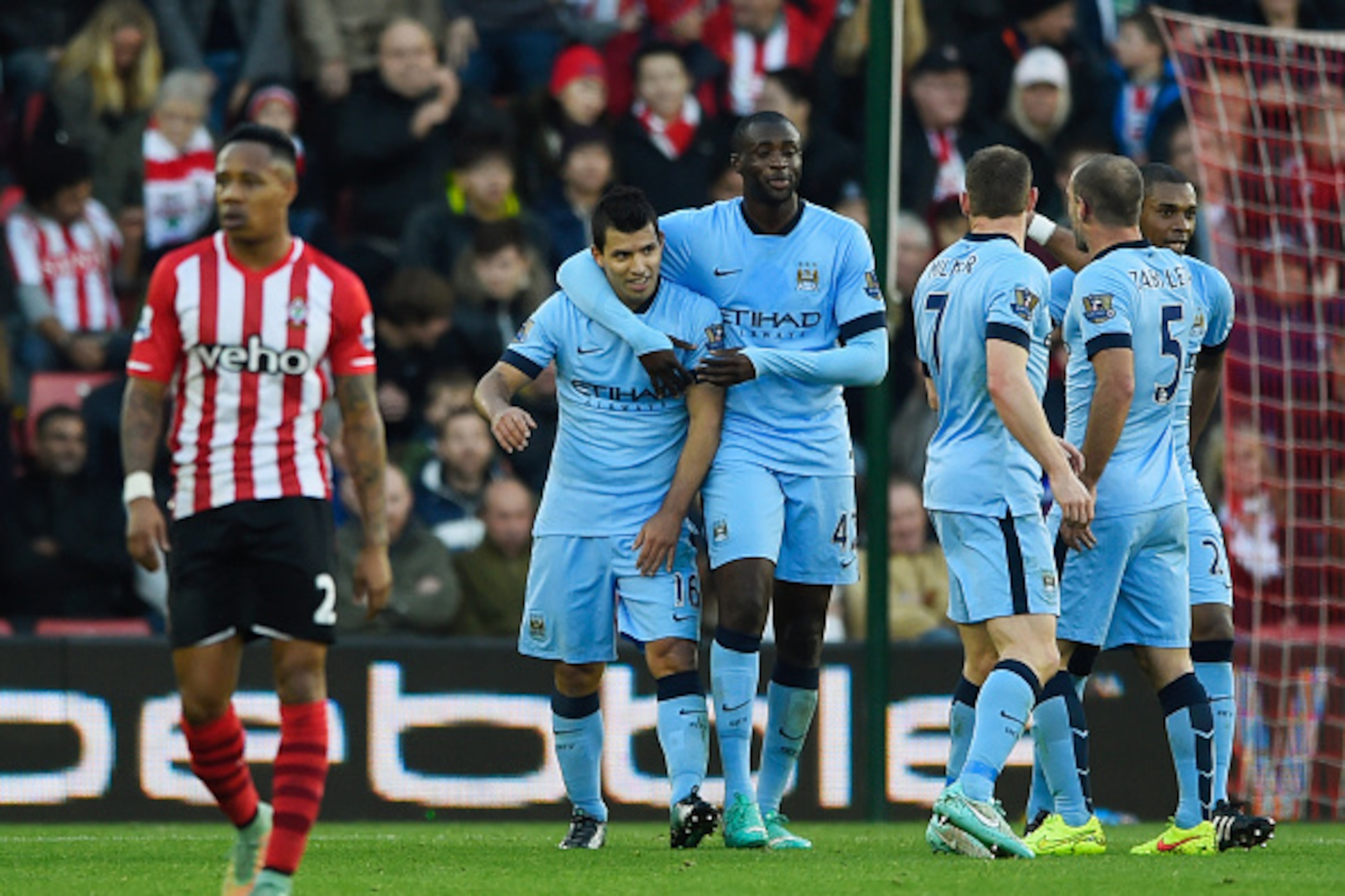 SOUTHAMPTON, ENGLAND - NOVEMBER 30: Despair for Nathaniel Clyne of Southampton as Sergio Aguero (16) and Yaya Toure (42) celebrate a goal by Gael Clichy of Manchester City (not pictured) for their thir goal during the Barclays Premier League match betwee SOUTHAMPTON, ENGLAND - NOVEMBER 30: Despair for Nathaniel Clyne of Southampton as Sergio Aguero (16) and Yaya Toure (42) celebrate a goal by Gael Clichy of Manchester City (not pictured) for their thir goal during the Barclays Premier League match betwee