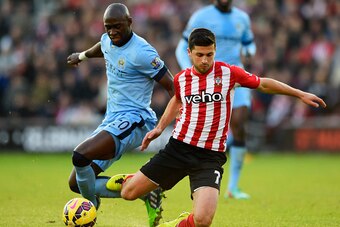 SOUTHAMPTON, ENGLAND - NOVEMBER 30:  Eliaquim Mangala of Manchester City challenges Shane Long of Southampton during the Barclays Premier League match between Southampton and Manchester City at St Mary's Stadium on November 30, 2014 in Southampton, Englan