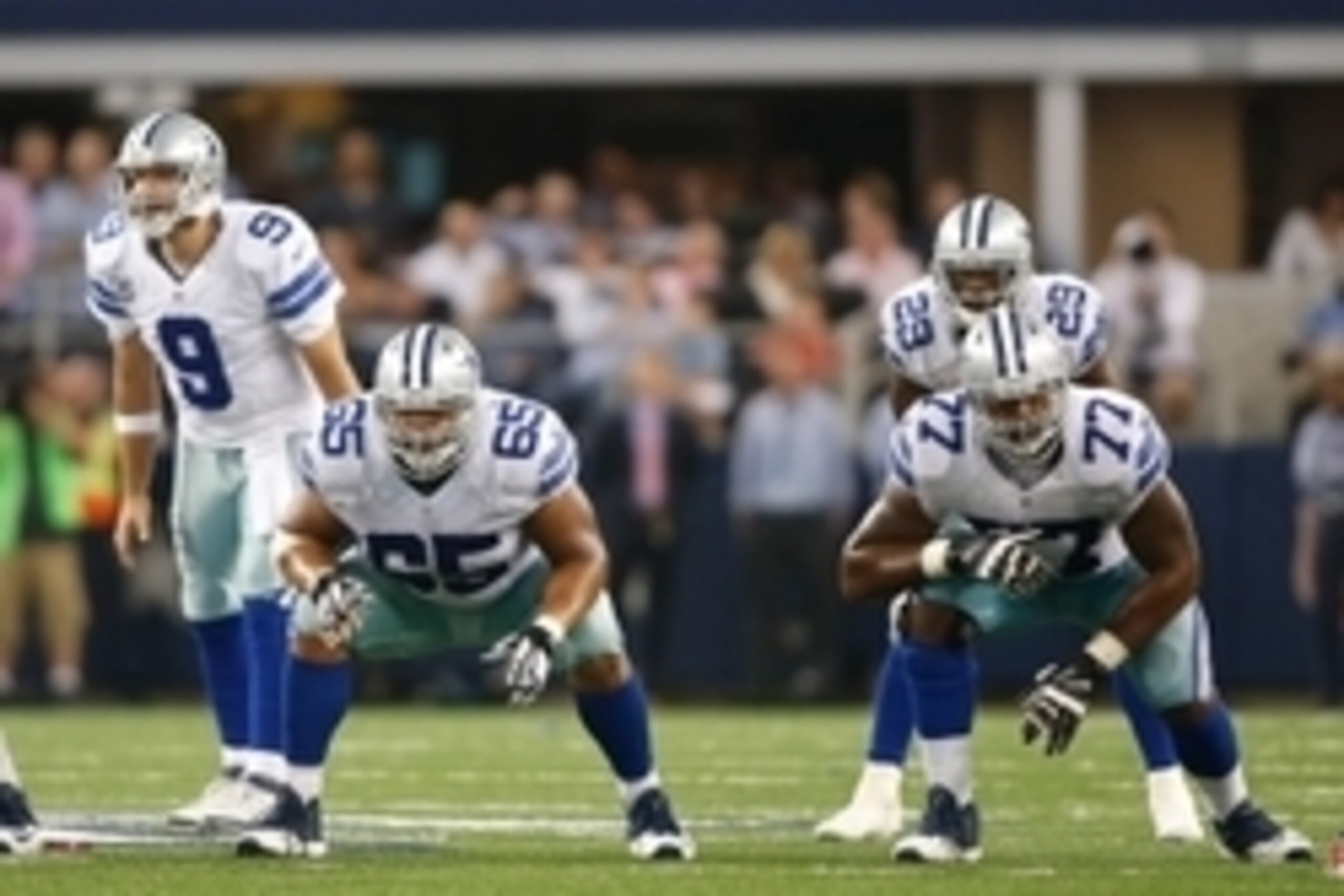 Oct 19, 2014; Arlington, TX, USA; Dallas Cowboys quarterback Tony Romo (9) and guard Ronald Leary (65) and tackle Tyron Smith (77) and running back DeMarco Murray (29) in game action against the New York Giants  at AT&T Stadium.  Dallas beat New York 31-2