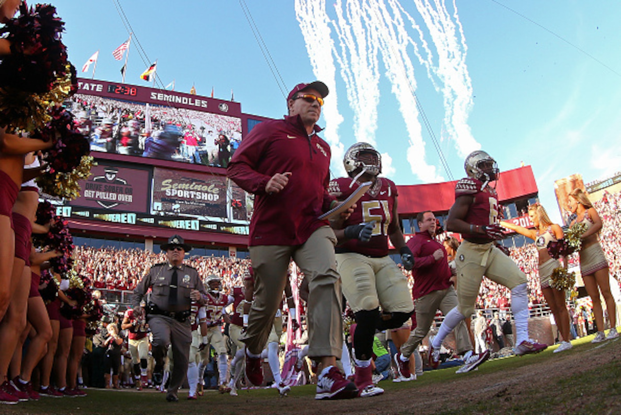 TALLAHASSEE, FL - NOVEMBER 29: Head coach Jimbo Fisher of the Florida State Seminoles leads the team onto the field during a game against the Florida Gators   at Doak Campbell Stadium on November 29, 2014 in Tallahassee, Florida.  (Photo by Mike Ehrmann/G