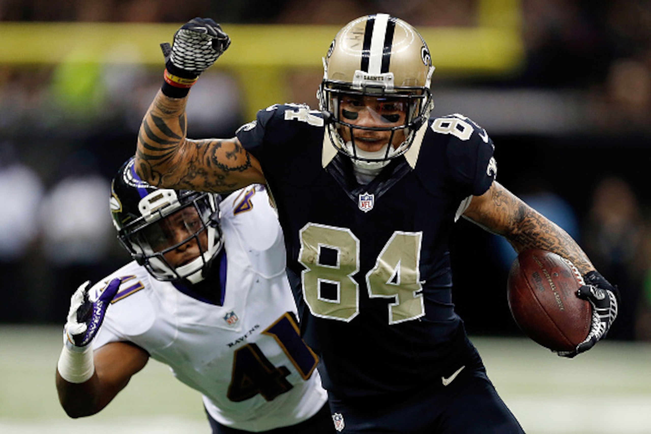 NEW ORLEANS, LA - NOVEMBER 24:  Kenny Stills #84 of the New Orleans Saints is pursued by Anthony Levine #41 of the Baltimore Ravens during the second quarter of a game at the Mercedes-Benz Superdome on November 24, 2014 in New Orleans, Louisiana.  (Photo 