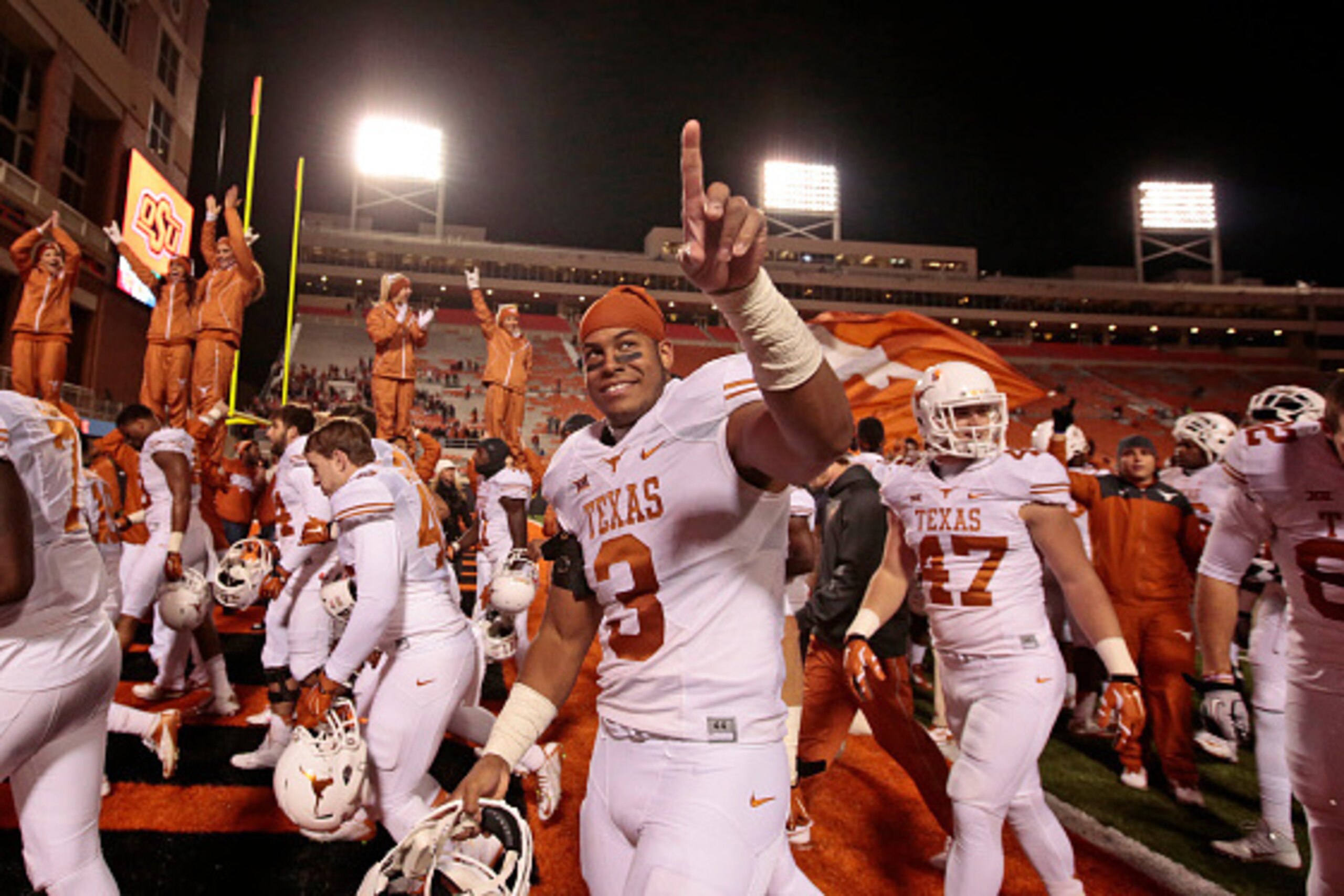 STILLWATER, OK - NOVEMBER 15:   Linebacker Jordan Hicks #3 of the Texas Longhorns celebrates after the game against the Oklahoma State Cowboys November 15, 2014 at Boone Pickens Stadium in Stillwater, Oklahoma. The Longhorns defeated the Cowboys 28-7.  (P