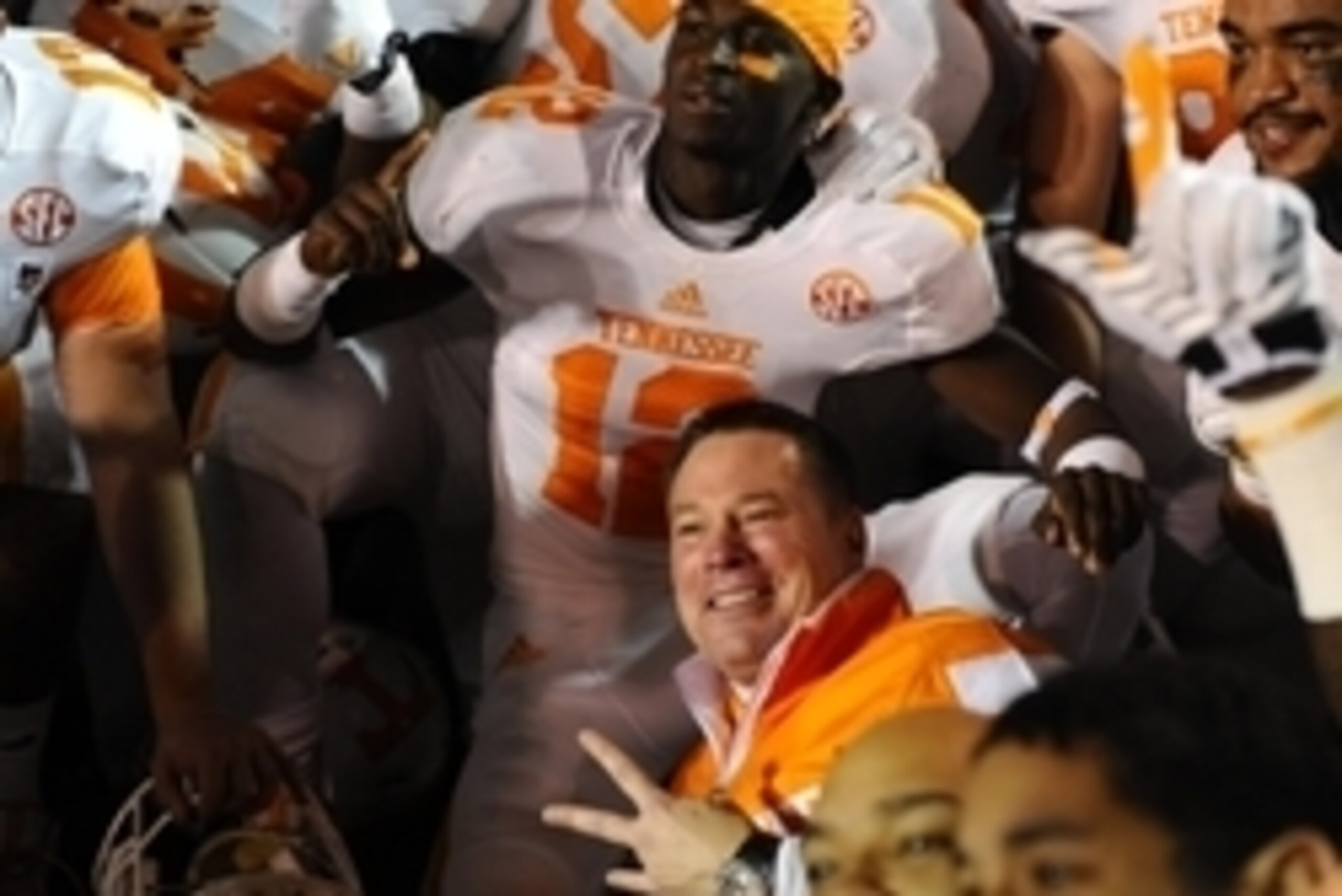 Nov 29, 2014; Nashville, TN, USA; Tennessee Volunteers head coach Butch Jones celebrates with players after a win against the Vanderbilt Commodores at Vanderbilt Stadium. The Volunteers won 24-17. Mandatory Credit: Christopher Hanewinckel-USA TODAY Sports