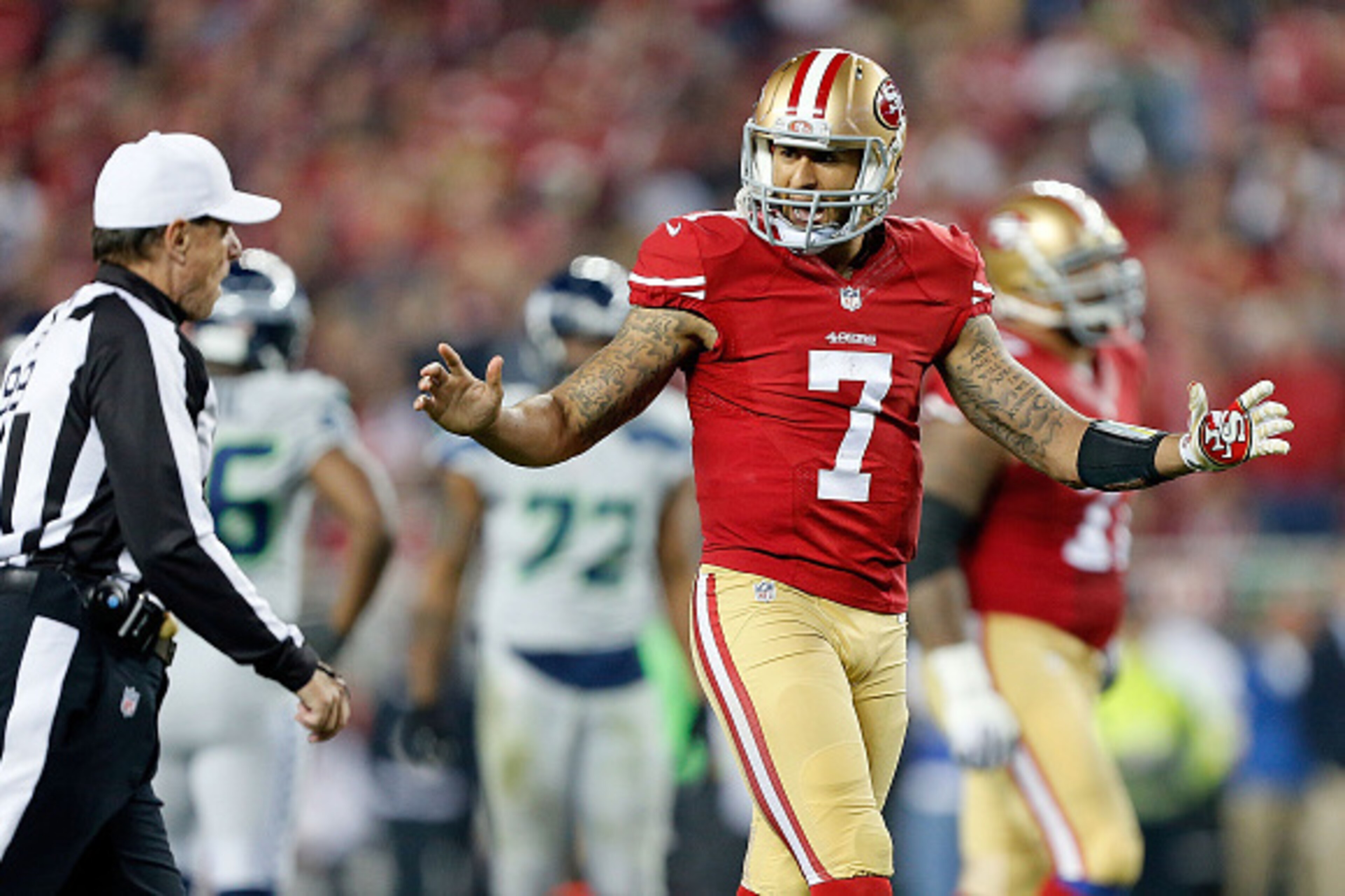 SANTA CLARA, CA - NOVEMBER 27:  Colin Kaepernick #7 of the San Francisco 49ers challenges a call in the second quarter against the Seattle Seahawks at Levi's Stadium on November 27, 2014 in Santa Clara, California.  (Photo by Brian Bahr/Getty Images)