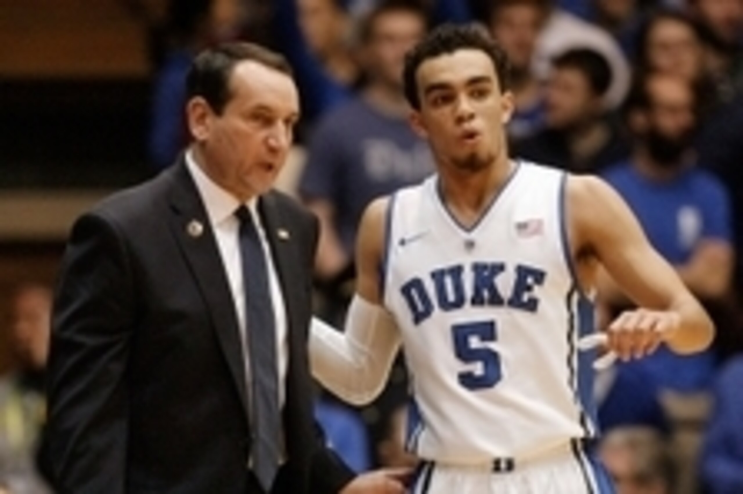 Nov 30, 2014; Durham, NC, USA; Duke Blue Devils head coach Mike Krzyzewski talks to guard Tyus Jones (5) in their game against the Army Black Knights at Cameron Indoor Stadium. Mandatory Credit: Mark Dolejs-USA TODAY Sports