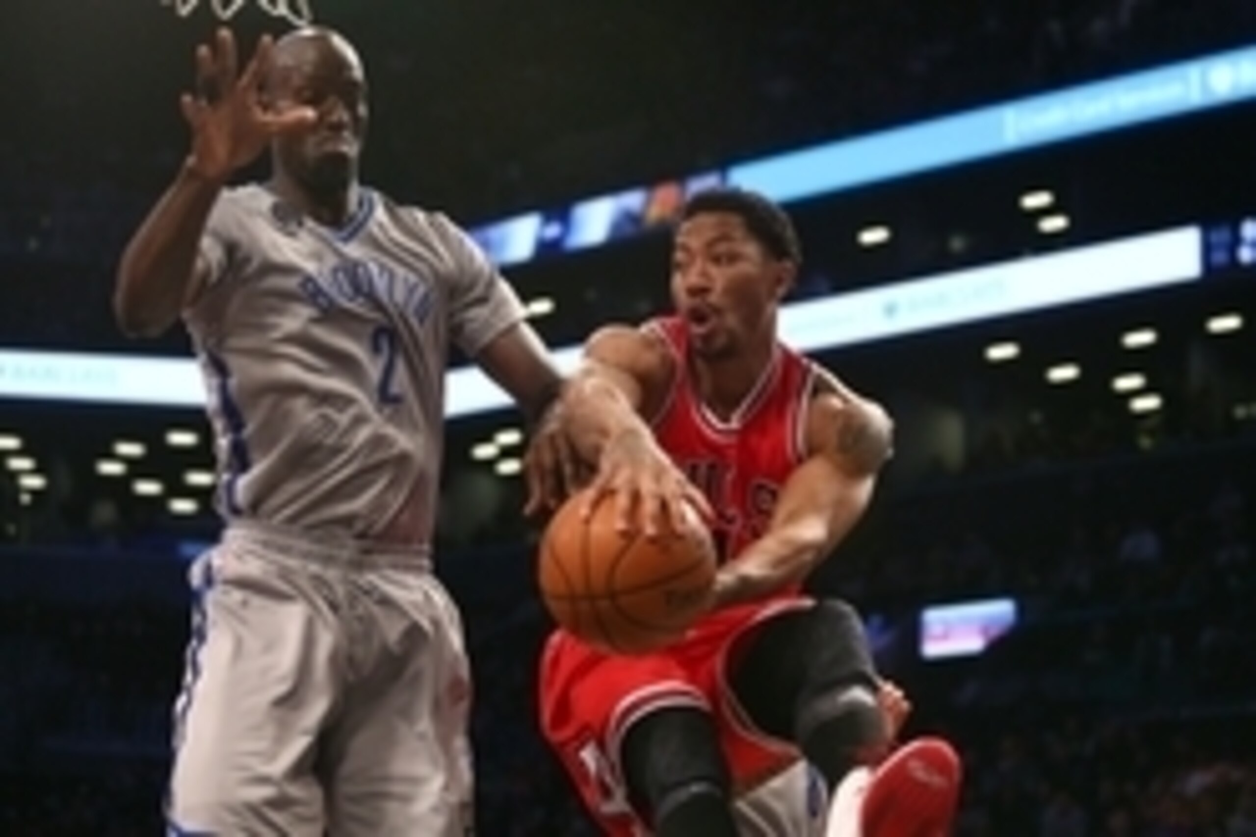 Nov 30, 2014; Brooklyn, NY, USA; Chicago Bulls point guard Derrick Rose (1) passes the ball around Brooklyn Nets power forward Kevin Garnett (2) during the first quarter at Barclays Center. Mandatory Credit: Brad Penner-USA TODAY Sports Nov 30, 2014; Brooklyn, NY, USA; Chicago Bulls point guard Derrick Rose (1) passes the ball around Brooklyn Nets power forward Kevin Garnett (2) during the first quarter at Barclays Center. Mandatory Credit: Brad Penner-USA TODAY Sports