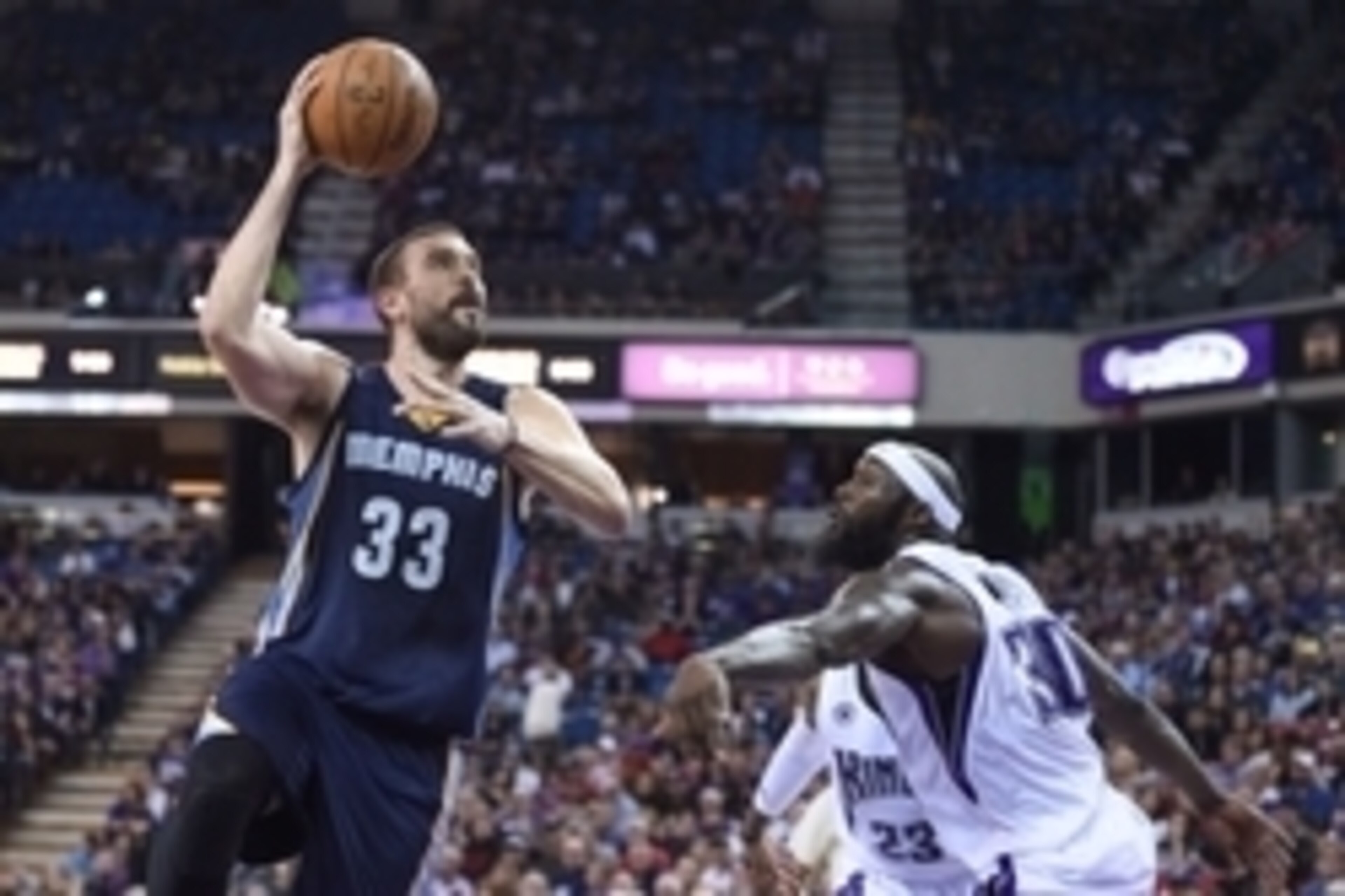 November 30, 2014; Sacramento, CA, USA; Memphis Grizzlies center Marc Gasol (33) shoots the basketball against Sacramento Kings forward Reggie Evans (30) during the third quarter at Sleep Train Arena. The Grizzlies defeated the Kings 97-85.  Mandatory Cre